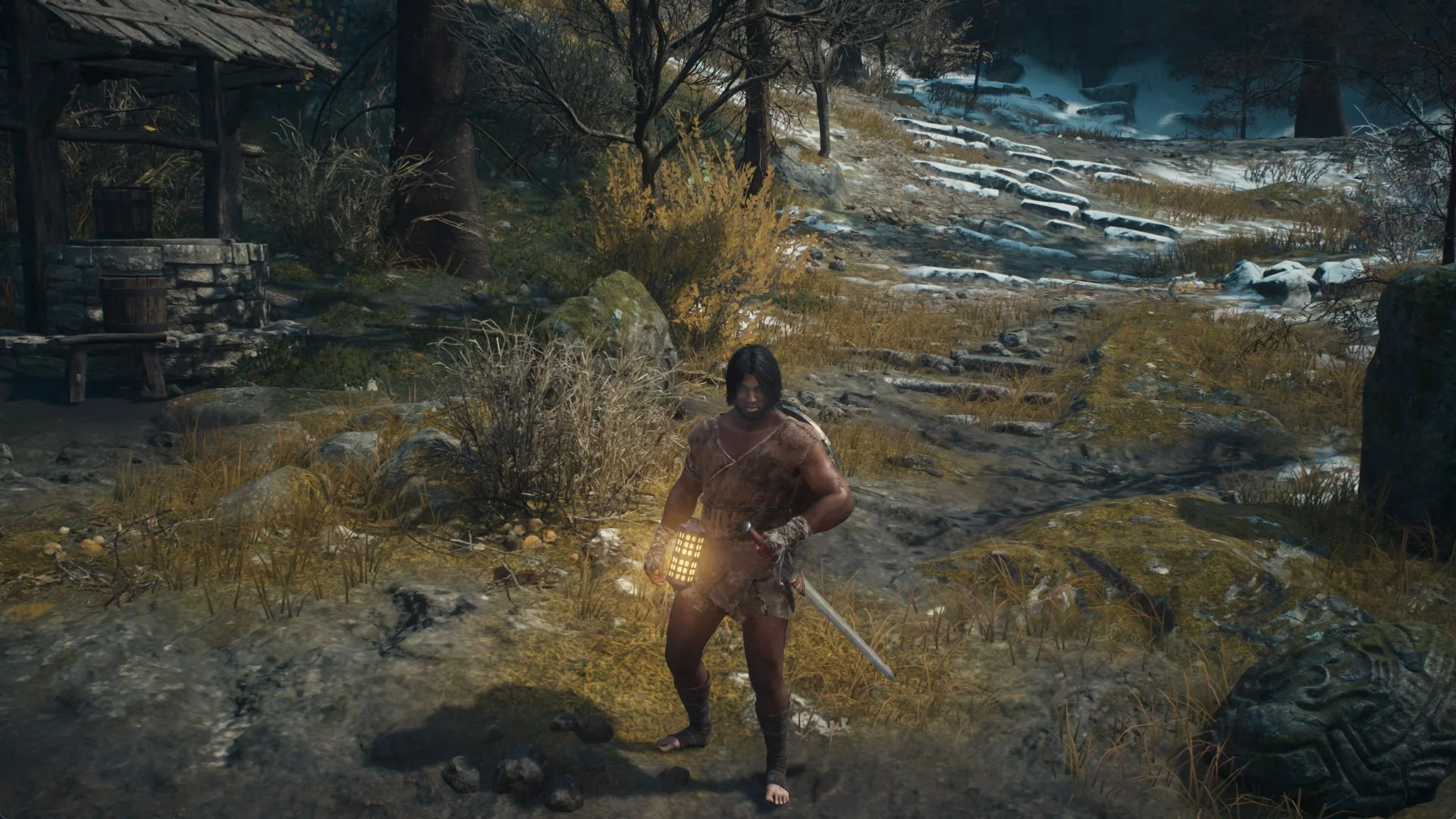 The Arisen holding a lit lantern beside a stone well, with snow on the slope behind