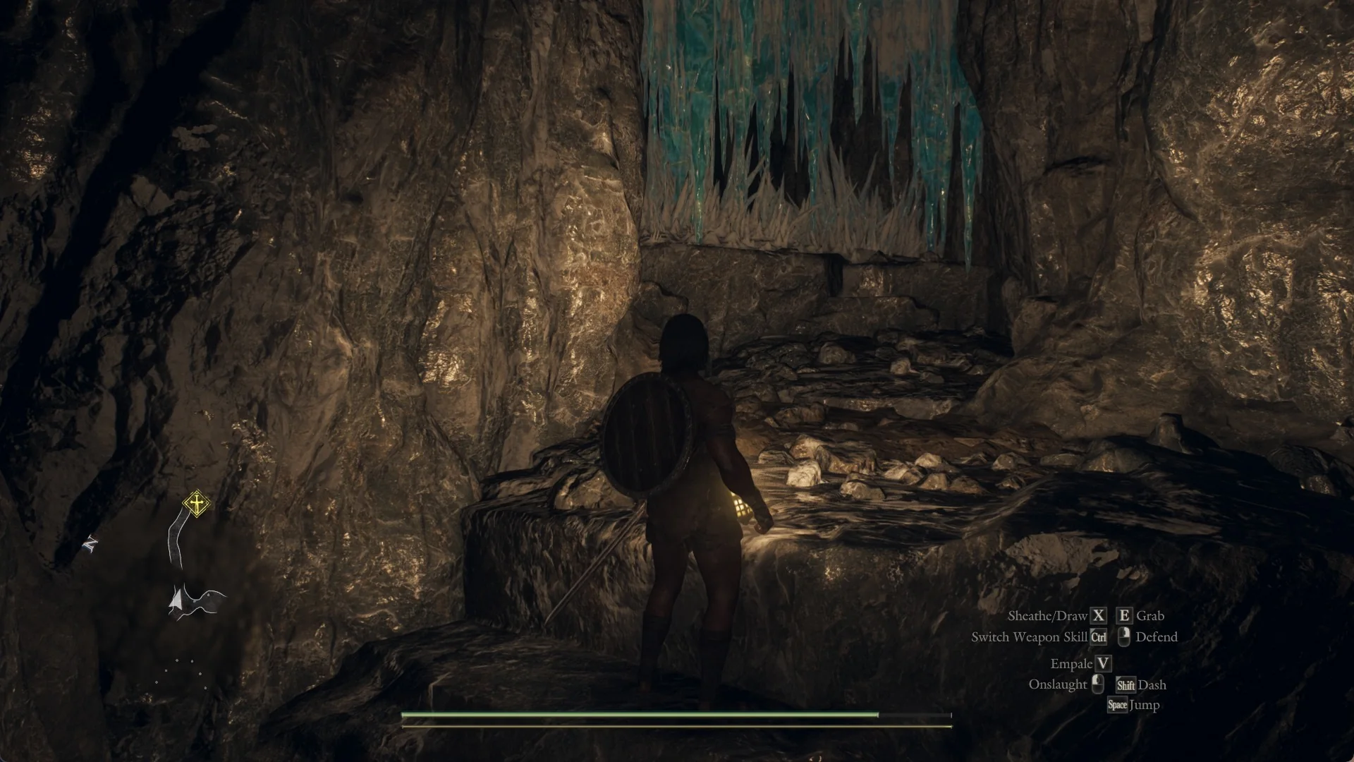 The Arisen with a lit lantern climbs rock steps toward a wall of clear blue ice in the Snowfall Valley Cavity