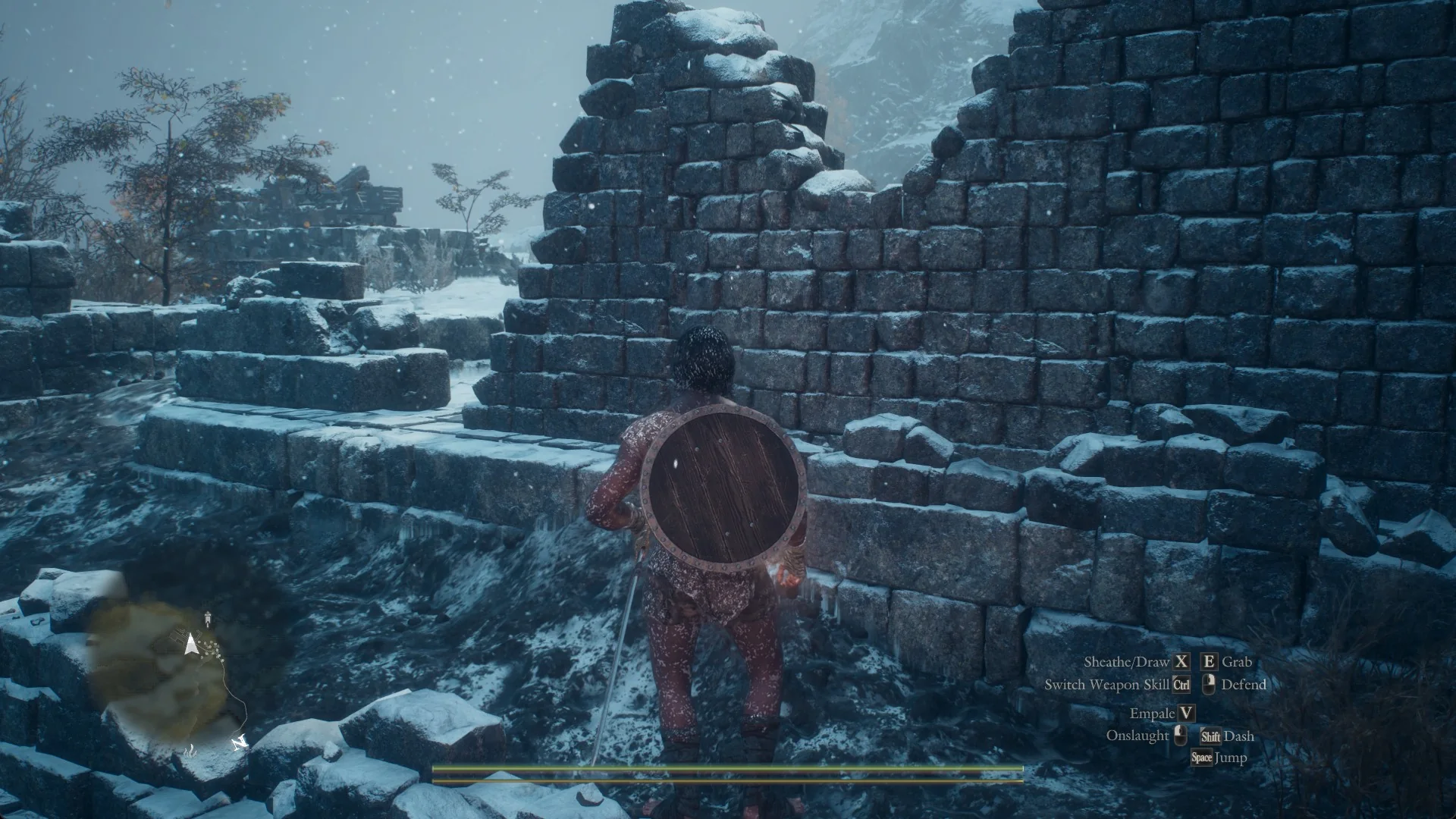 The Arisen in front of a crumbling snow-covered stone wall among the ruins of the Deserted Lakeside Estate