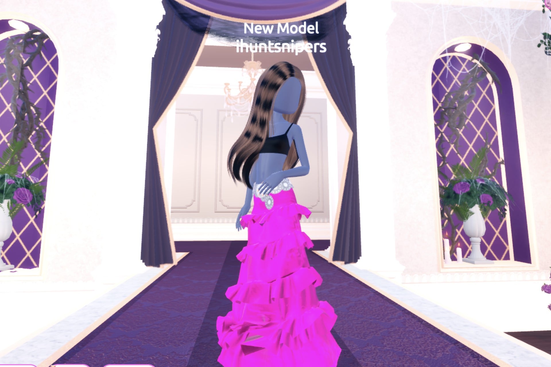 Front view of the pop-star glam look on the Freeplay Runway: hot-pink glitter tiered gown with a silver belt, black top, Dazzle pose