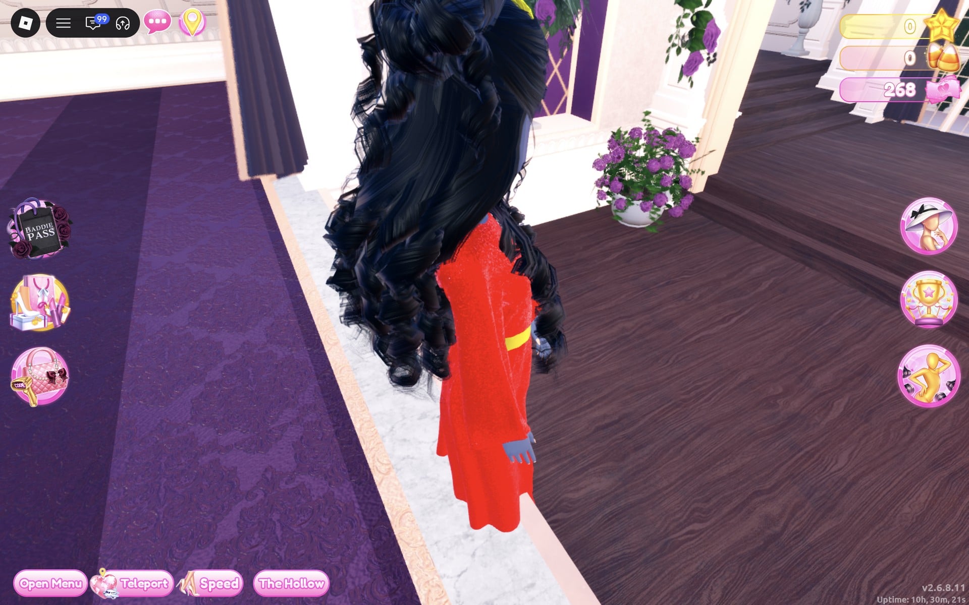 Red gown look from the side and back on the Freeplay Runway, long black curls over the red gown