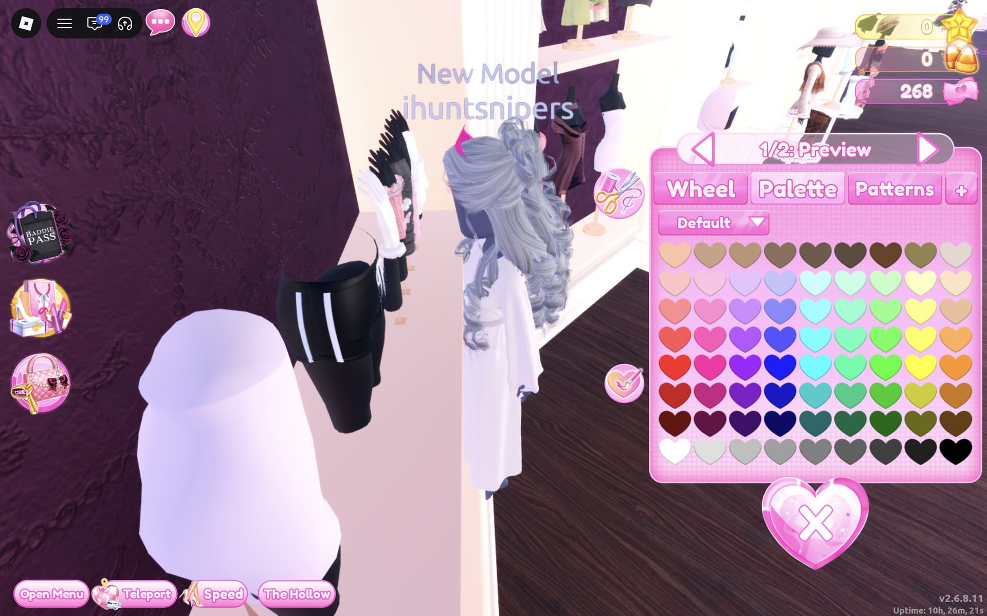 The white hooded robe previewing on the character beside its mannequin by the short-dress shelf, colour panel at 1/2: Preview