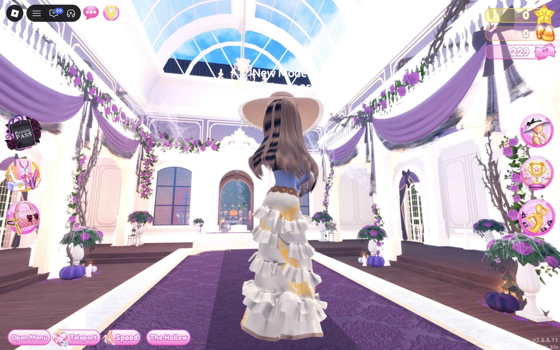Back view of the ruffled tiered gown with long wavy brown hair under the tan sun hat