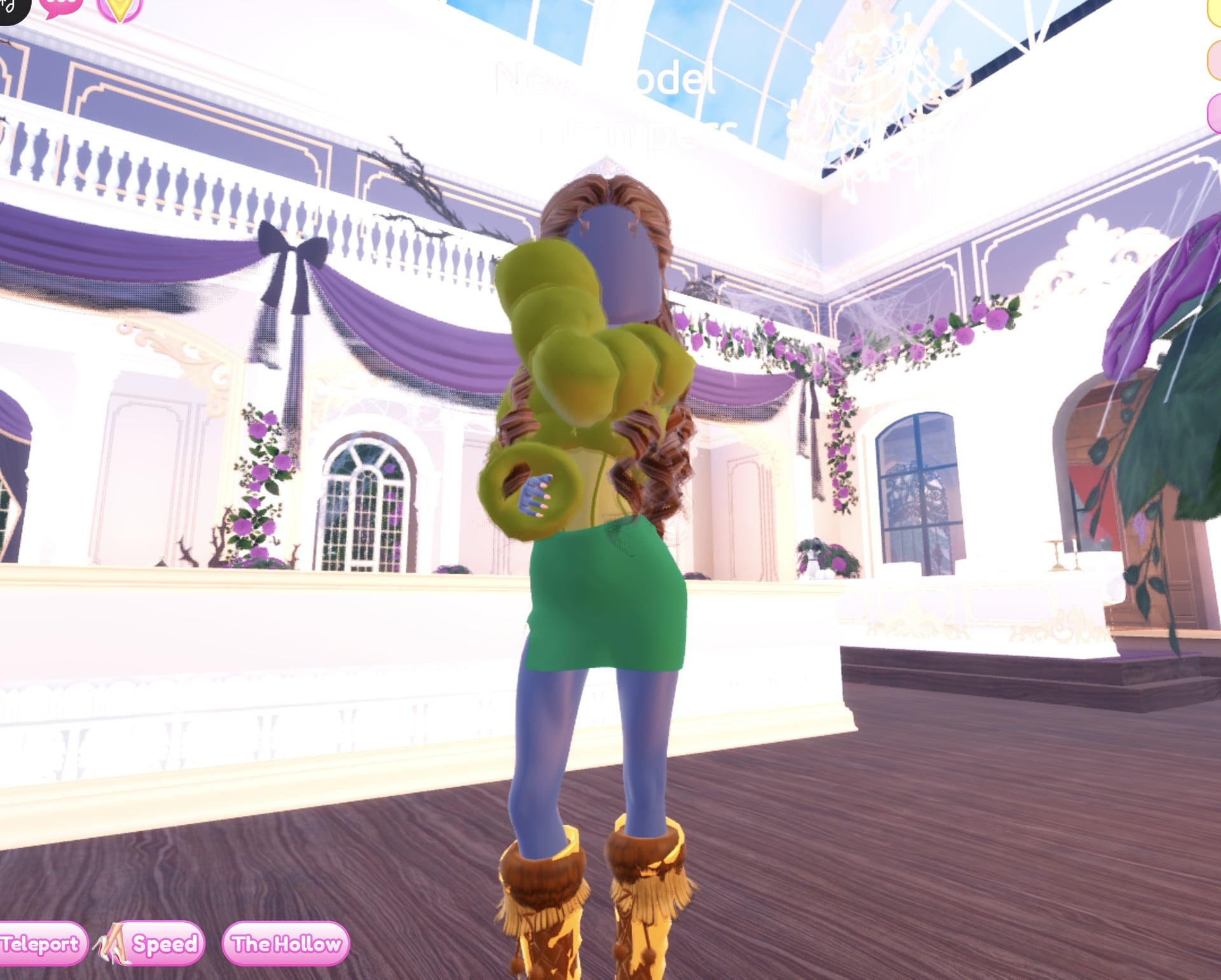 The olive fur and green mini look in the Satin pose, one olive fur sleeve forward