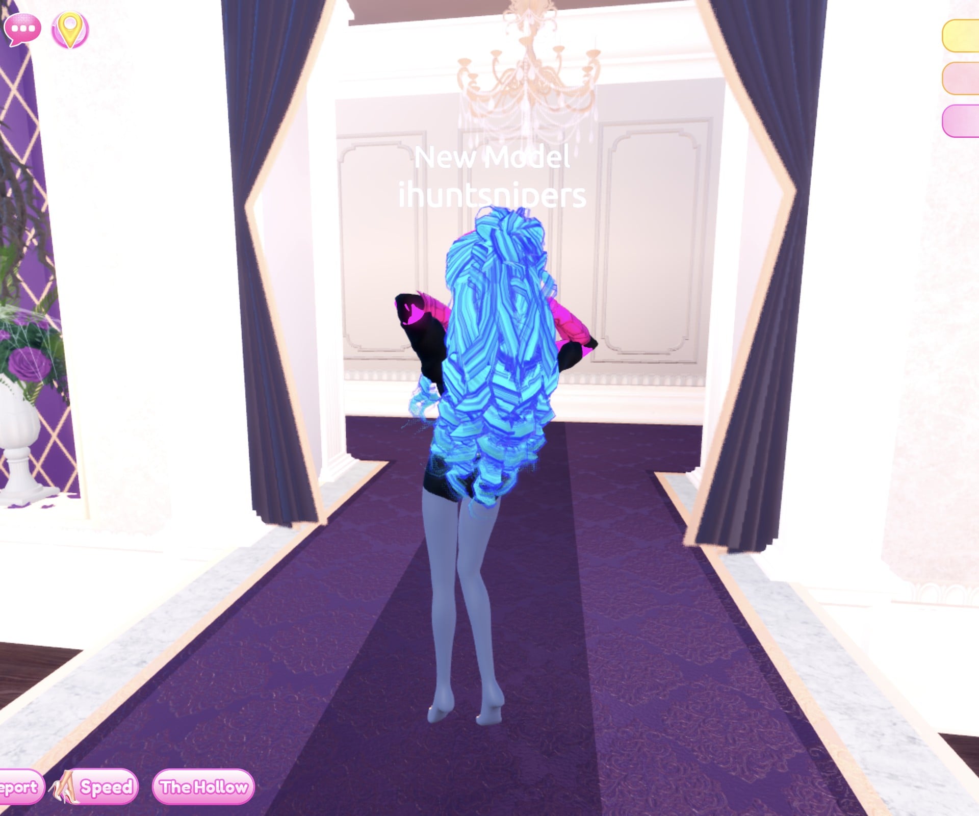 Look 2 from behind, glowing cyan and blue curls over the jacket, one arm raised
