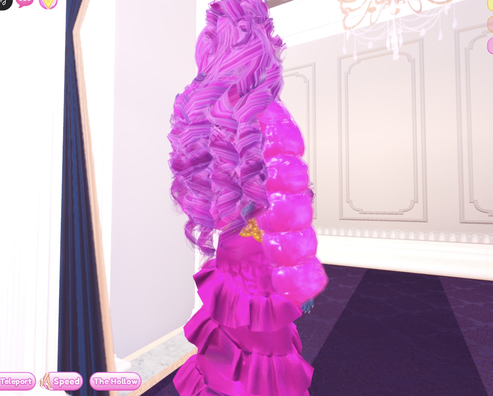 Hot pink look from the side and back: long pink curls over the puffed pink Foil jacket sleeve and the pink gown