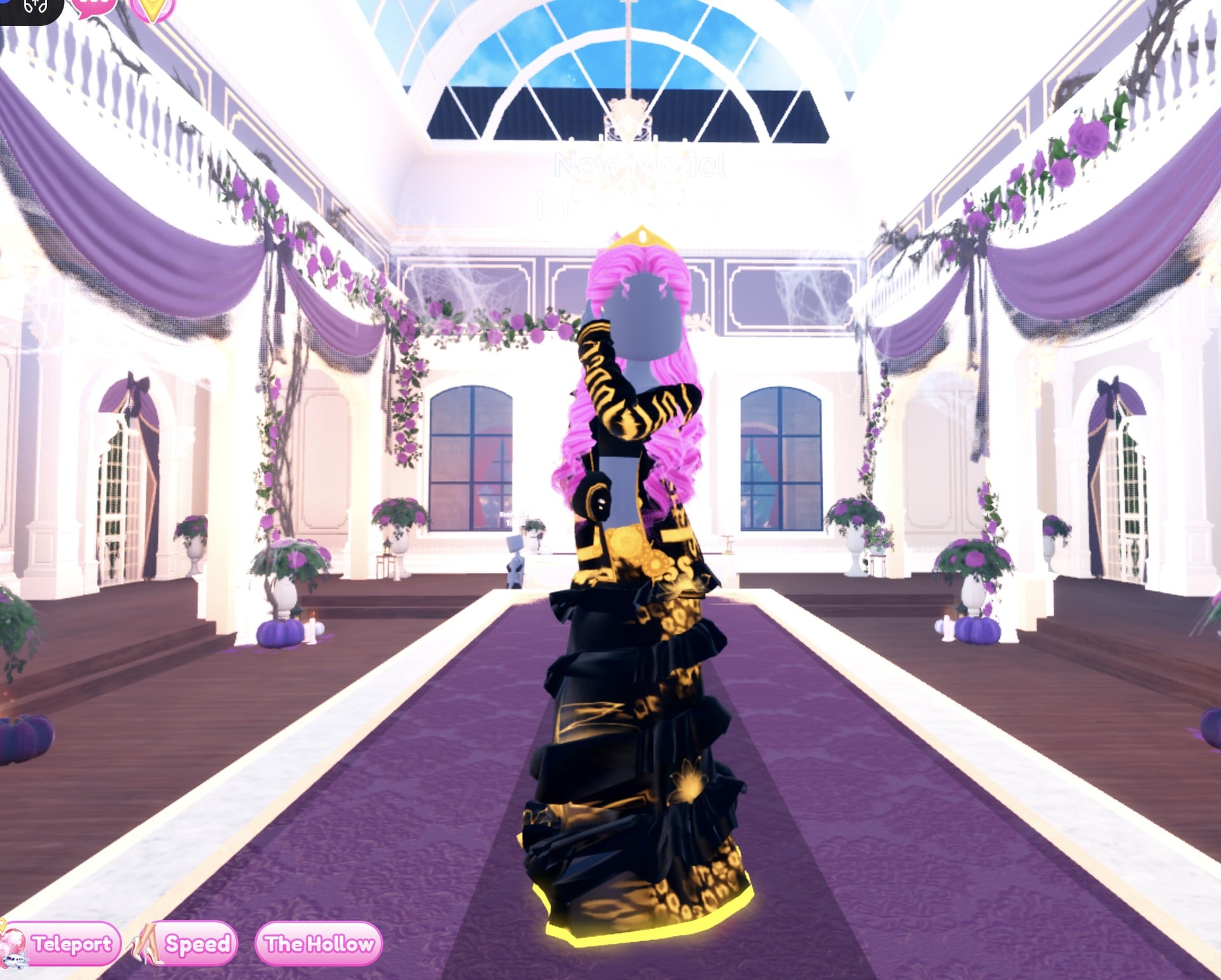 Black and gold look from the side in the Satin pose, gold lettering on the black jacket sleeve