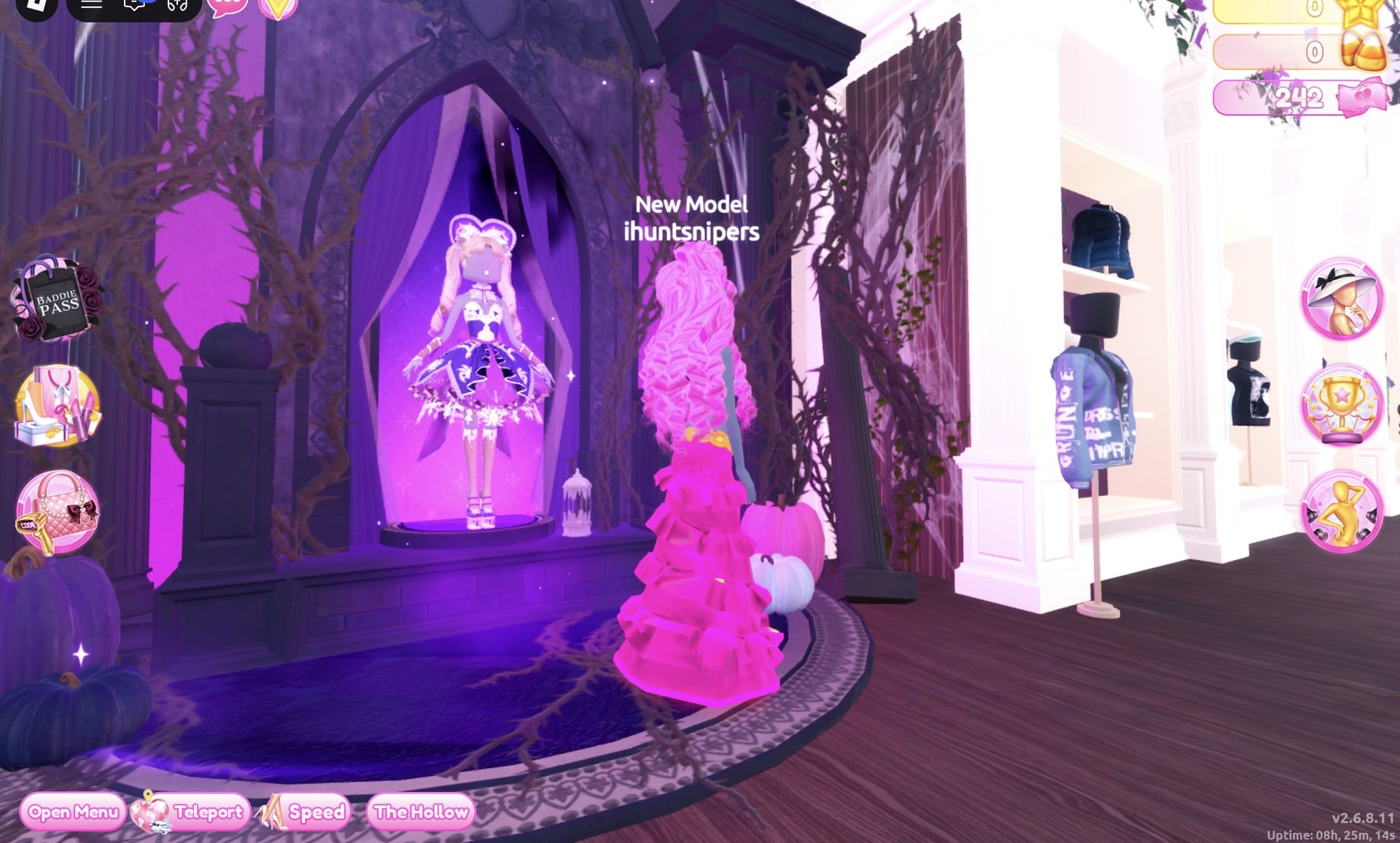 The jacket wall beside the purple Halloween display in the Dressing Room, character in the hot pink gown