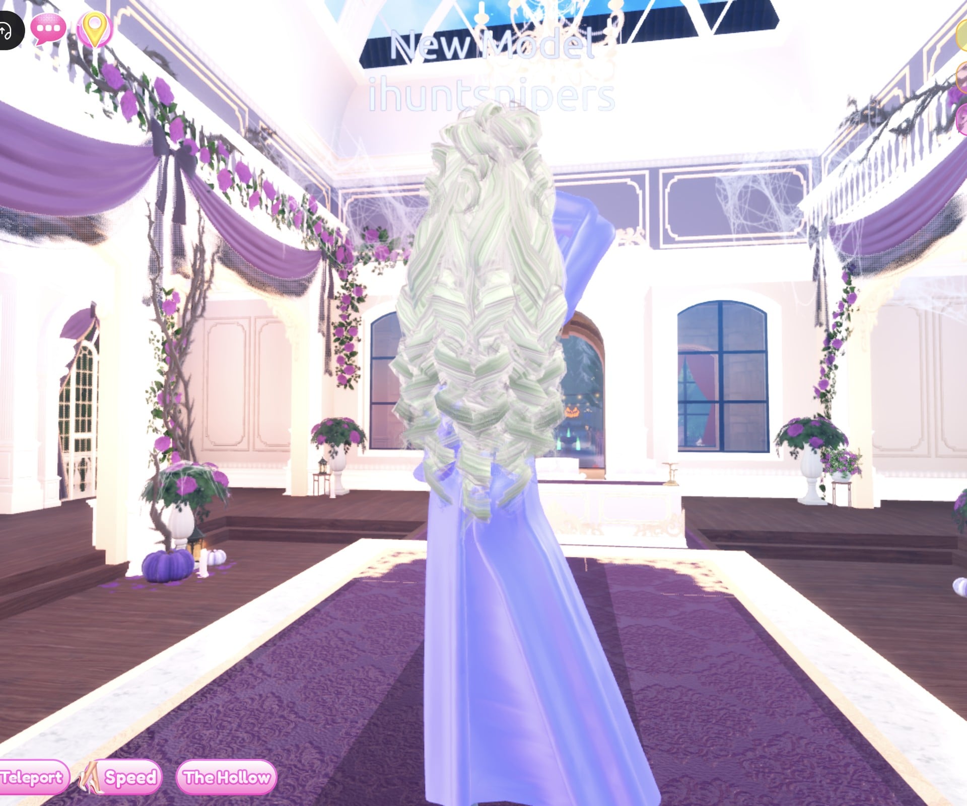 The princess look from the back, long pale blonde curls over the gown