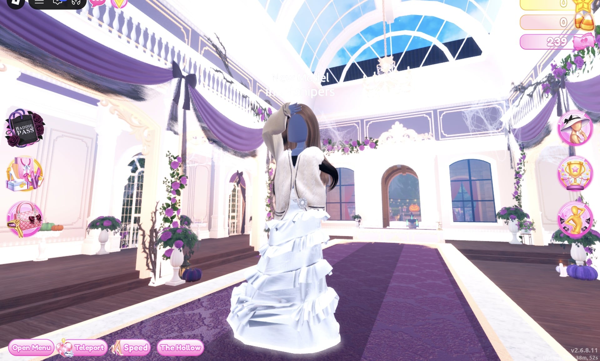 All-white Monochrome Mood look on the runway: white ruffled gown, silver belt and cream cardigan