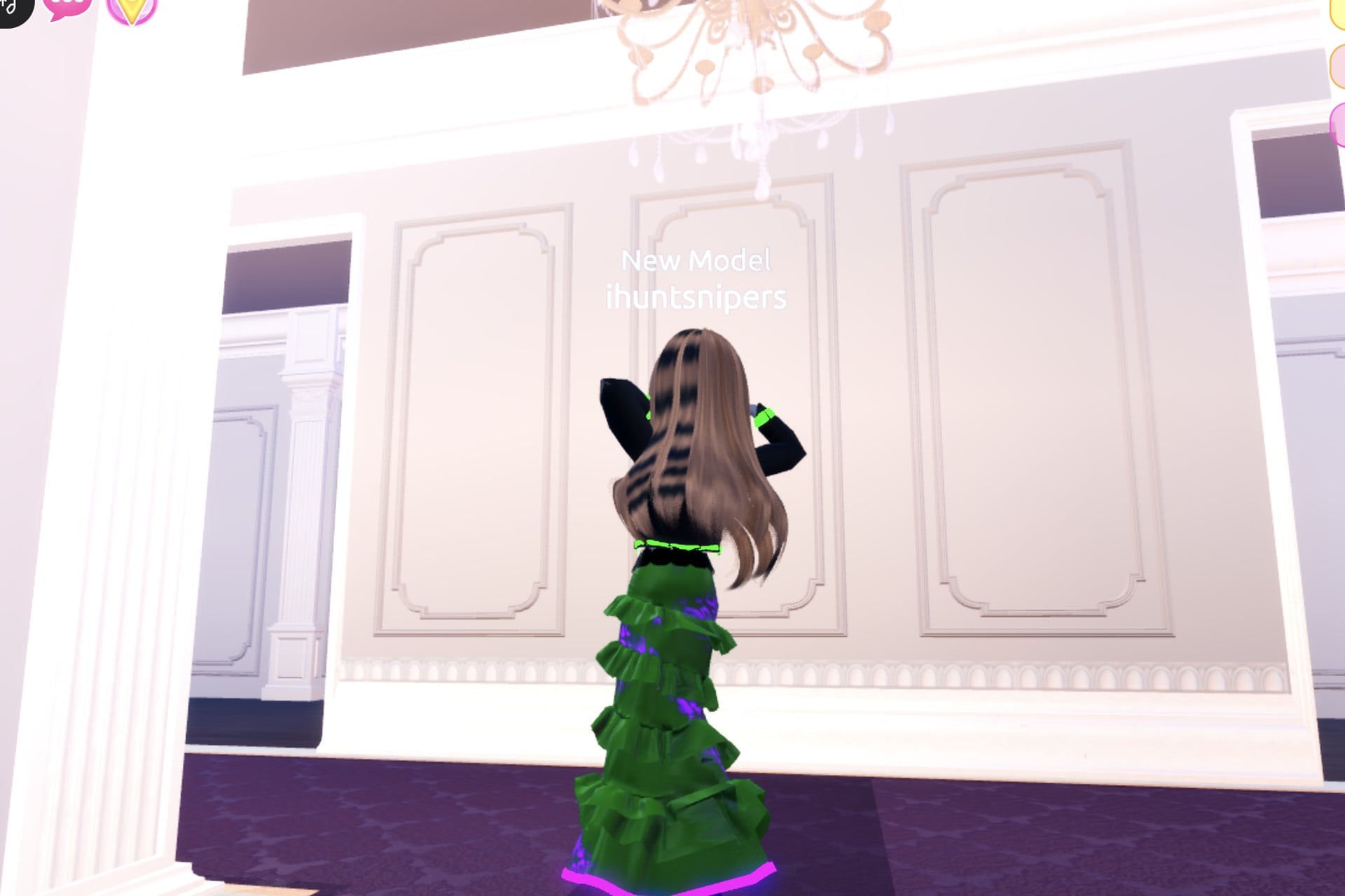 Alchemist look from the back: black jacket with green band, green gown, purple glowing hem