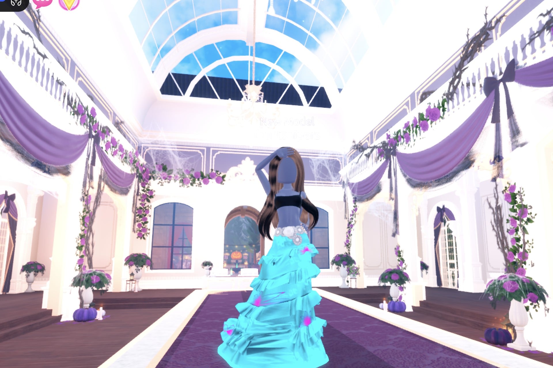 Glowing potion look on the Freeplay Runway: glittery turquoise ruffled gown with a glowing cyan hem, pink flower details and a silver belt
