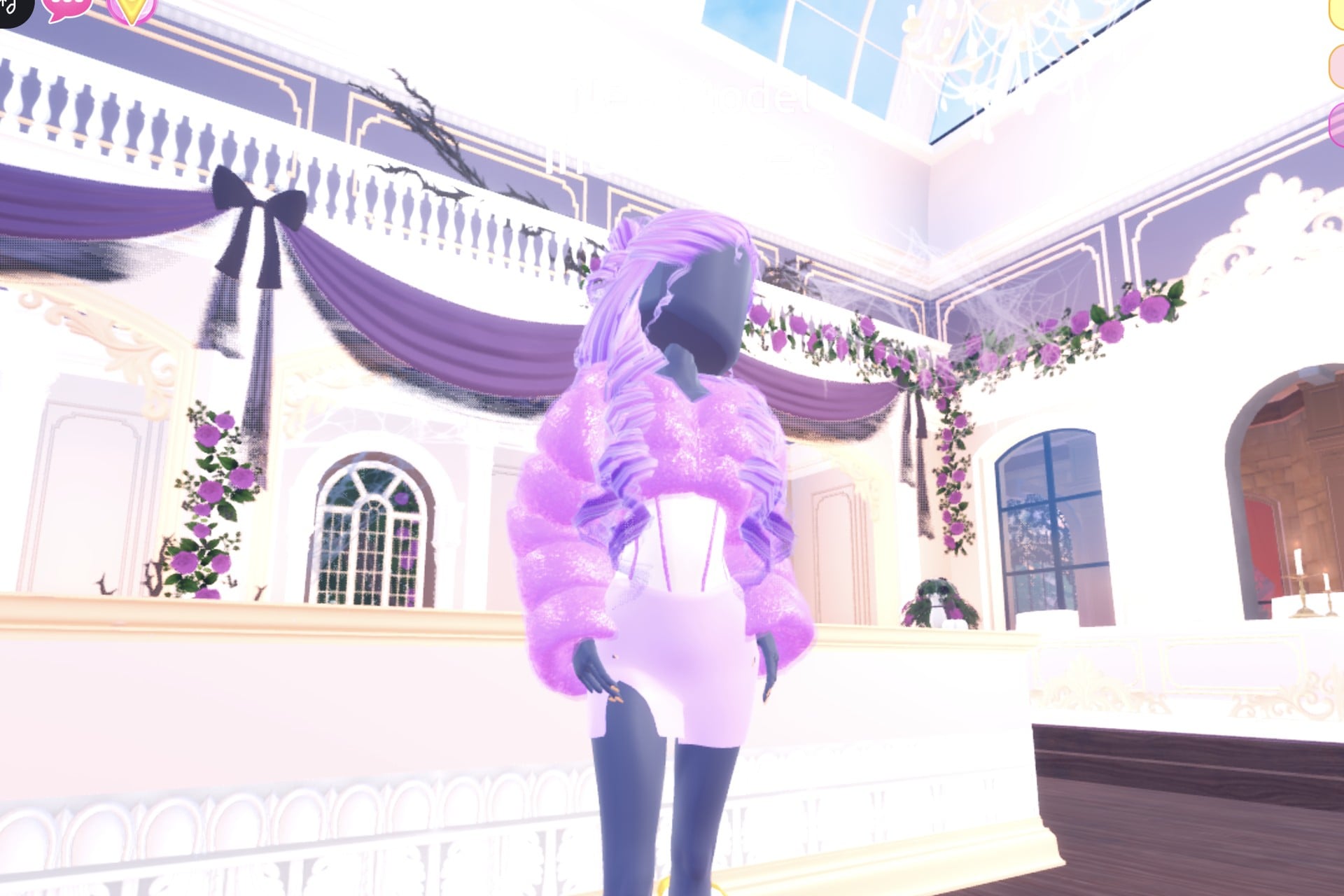 Lilac Sweet 16 look: lilac curls, sparkly lilac cropped fur jacket over a white corset mini dress, pink heels with knee socks