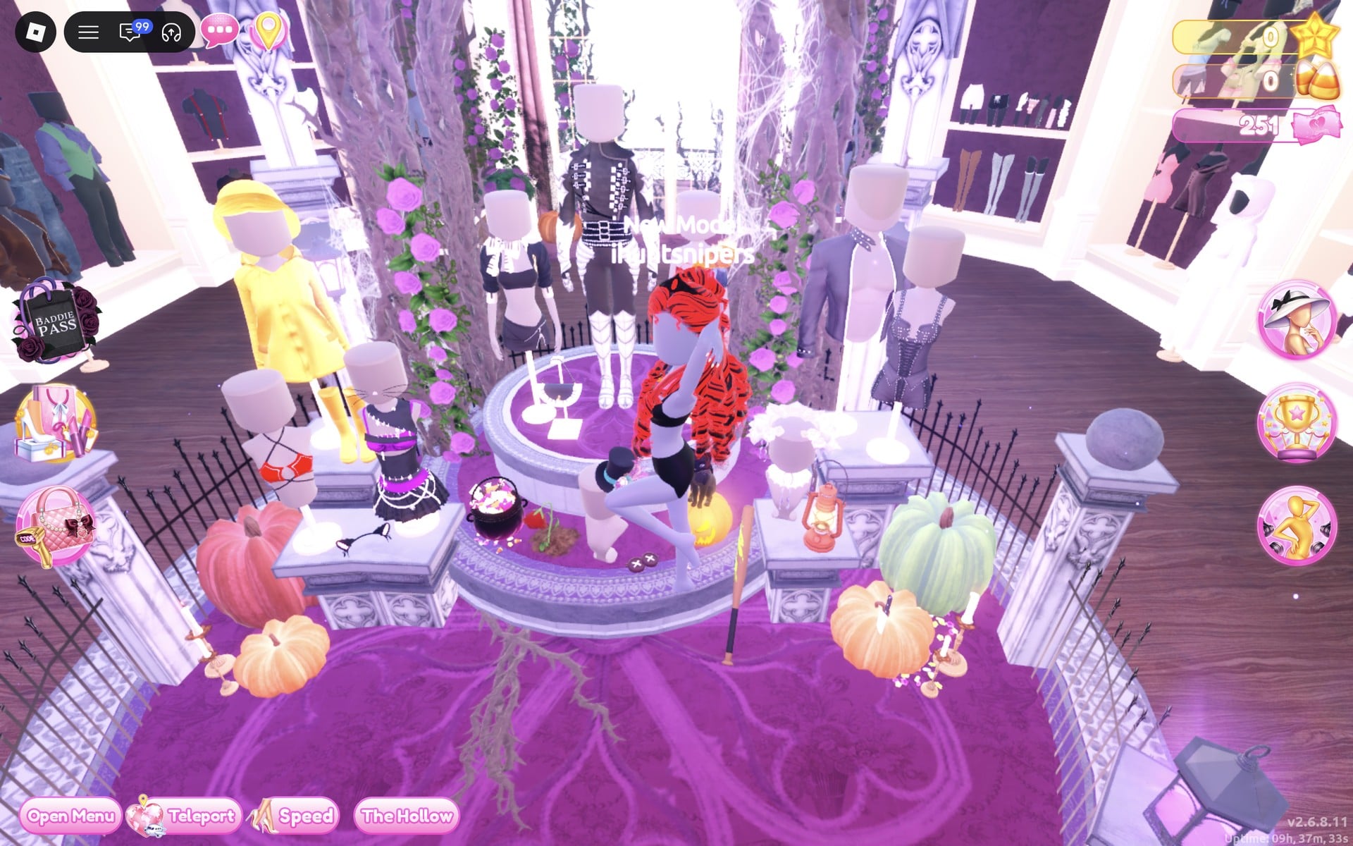 The Halloween display circle: a round fenced podium with thorny trees, pumpkins and mannequins, the black studded corset top on the right