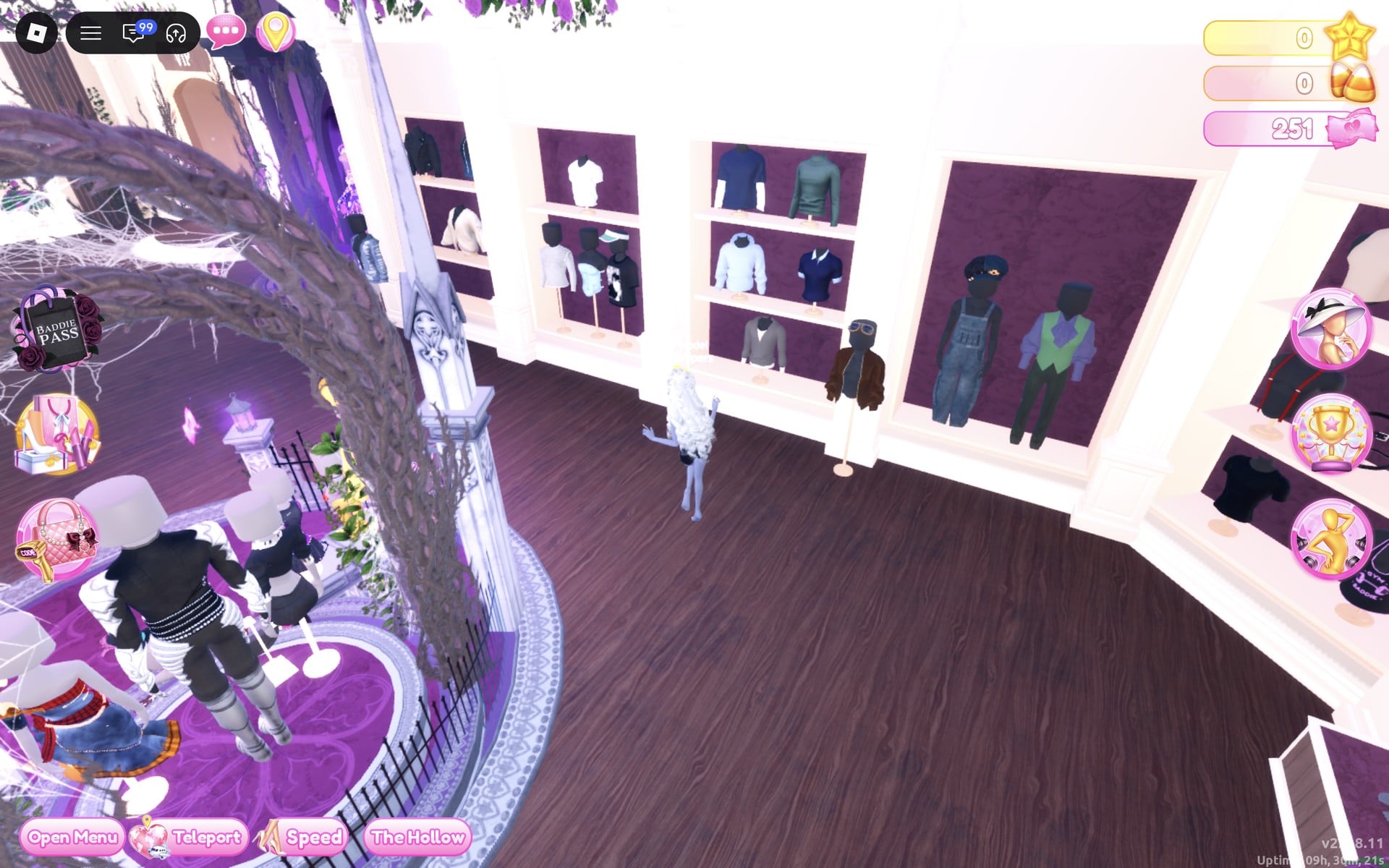 Men's-wear wall beside the Halloween display circle: shelves of tops, a brown bomber jacket with goggles on a stand, and blue denim overalls on a mannequin in the next alcove