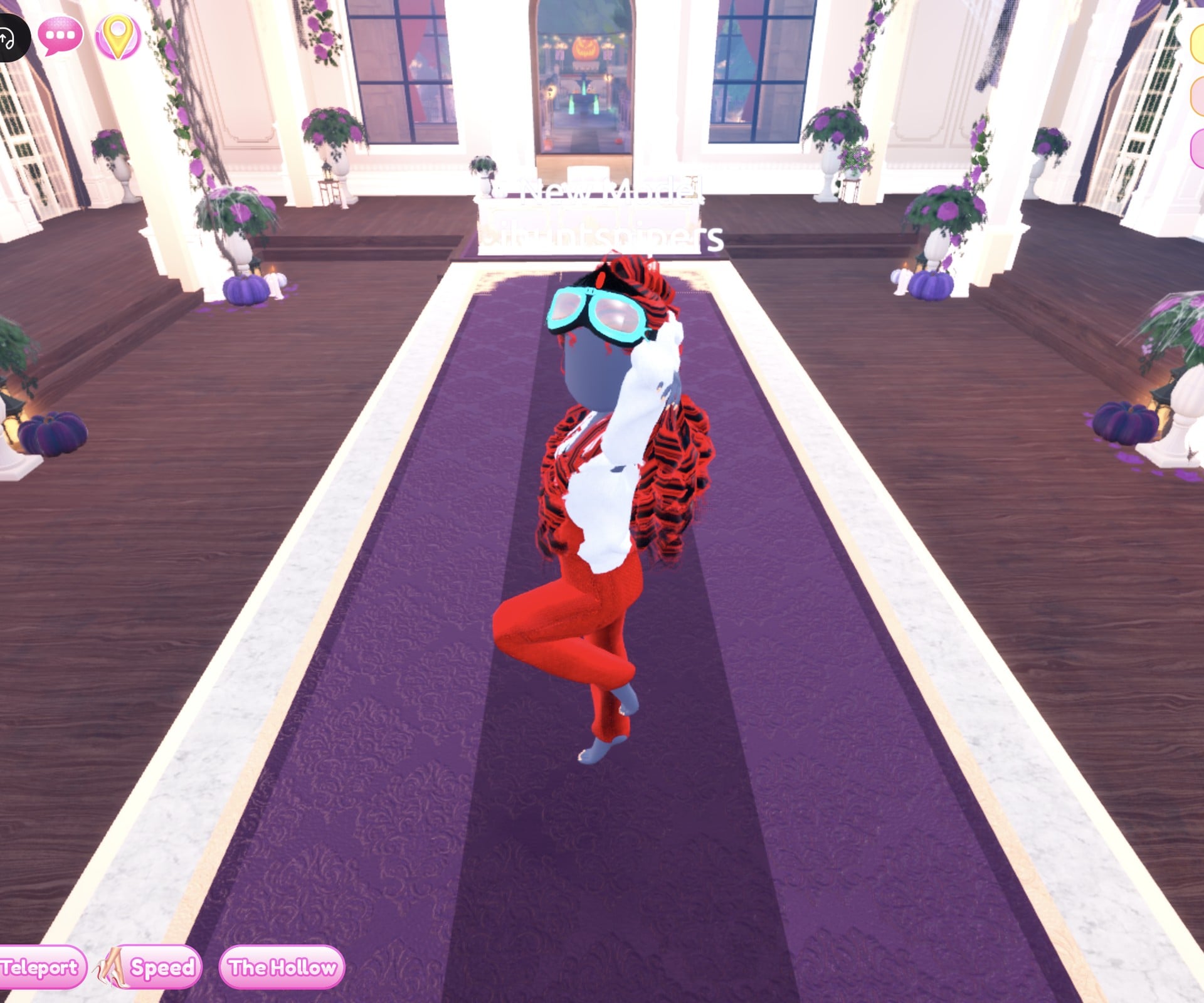 Racer look on the Freeplay Runway in the Confident pose: red Leather overalls, white bomber off the shoulders, cyan Neon goggles and red and black curls, one knee lifted