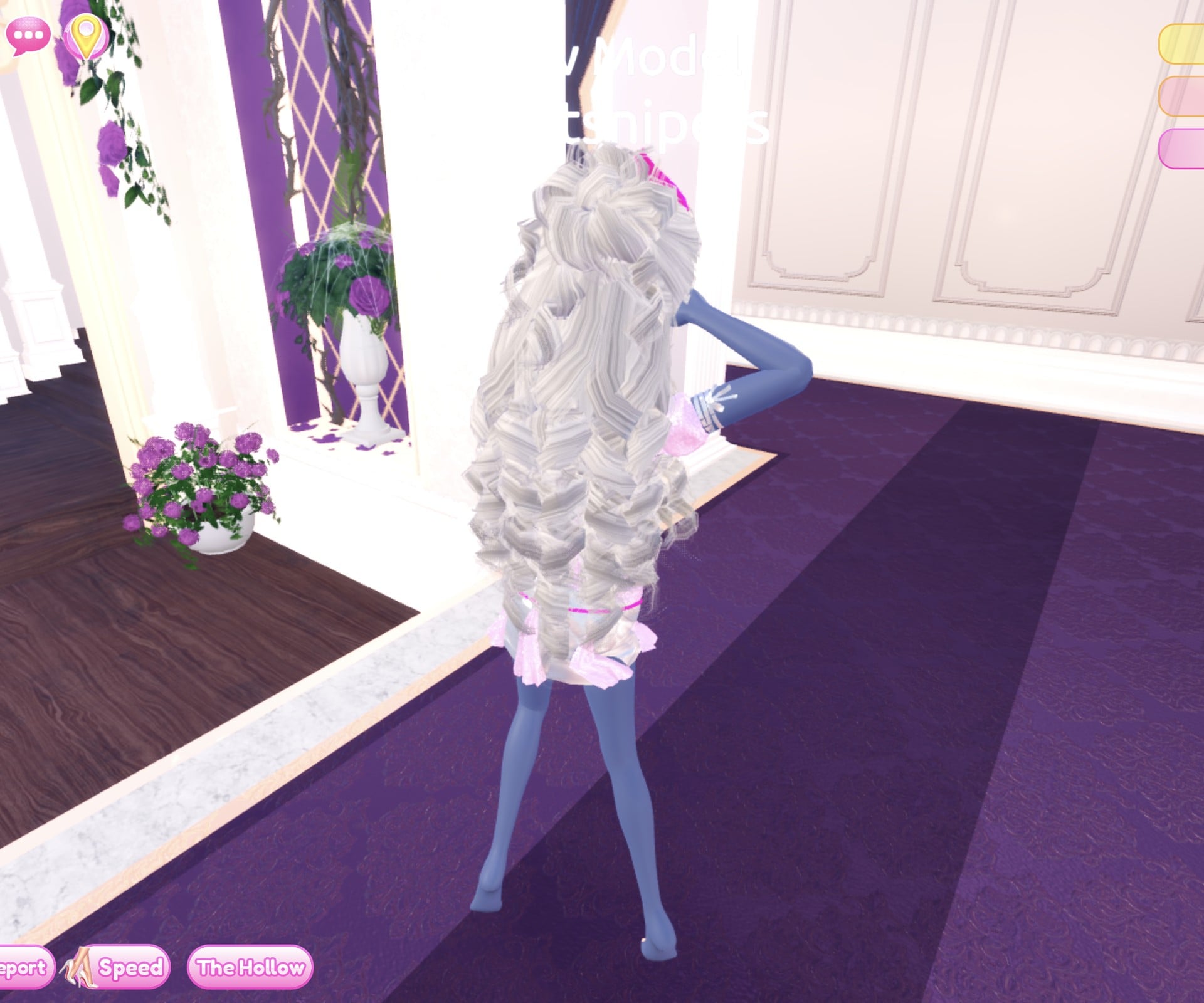 Look 1 from behind, long cream-white curls over the back, pink skirt frills below