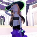 Potion Maker witch look: deep purple ruffled gown and black sun hat with a green Neon edge