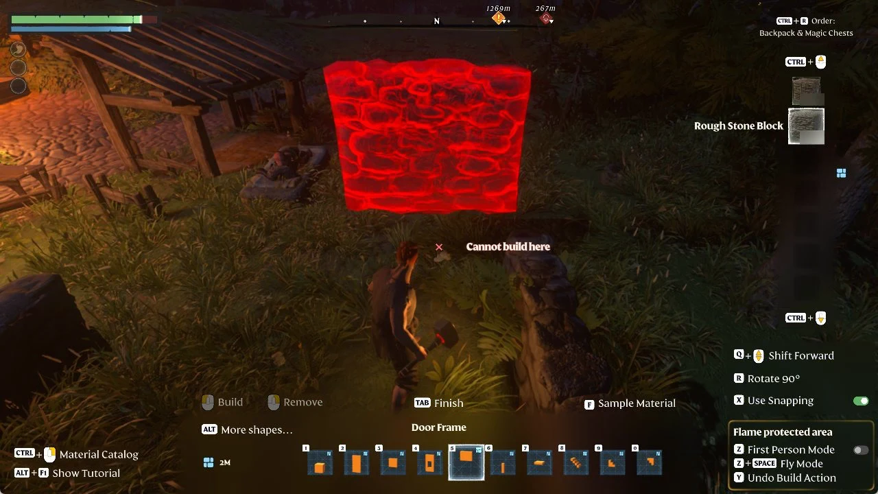 Door Frame preview in Rough Stone Block blocked from placement near the camp