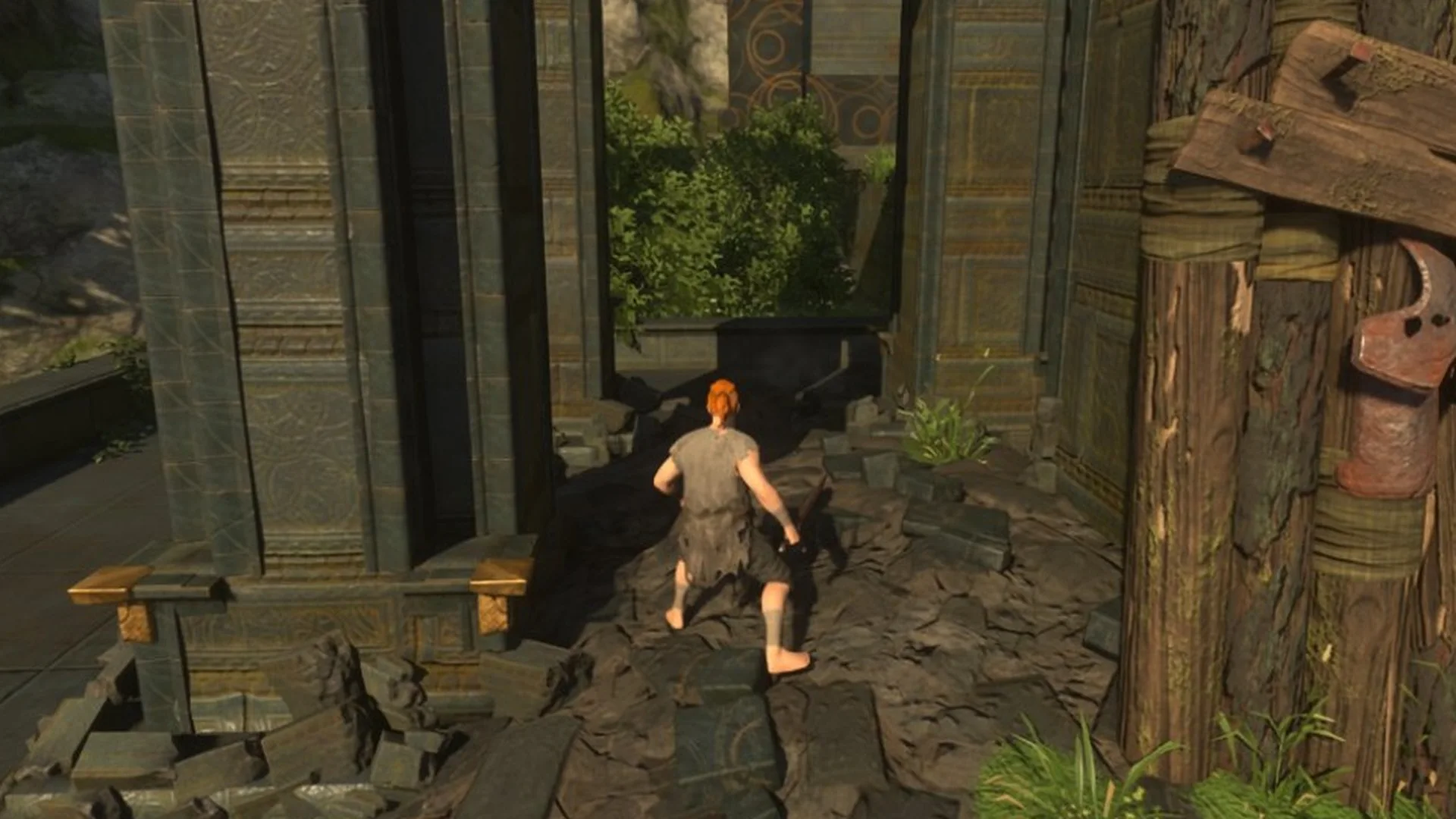 Enshrouded character climbing over rubble beside a wooden palisade and the vault's stone columns