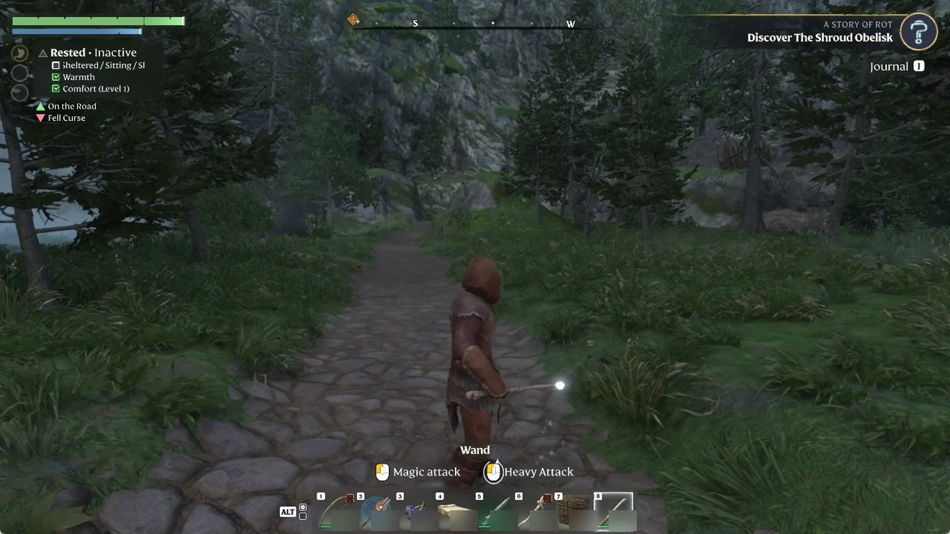 Enshrouded character firing a Wand, an ice bolt flying down a stone path