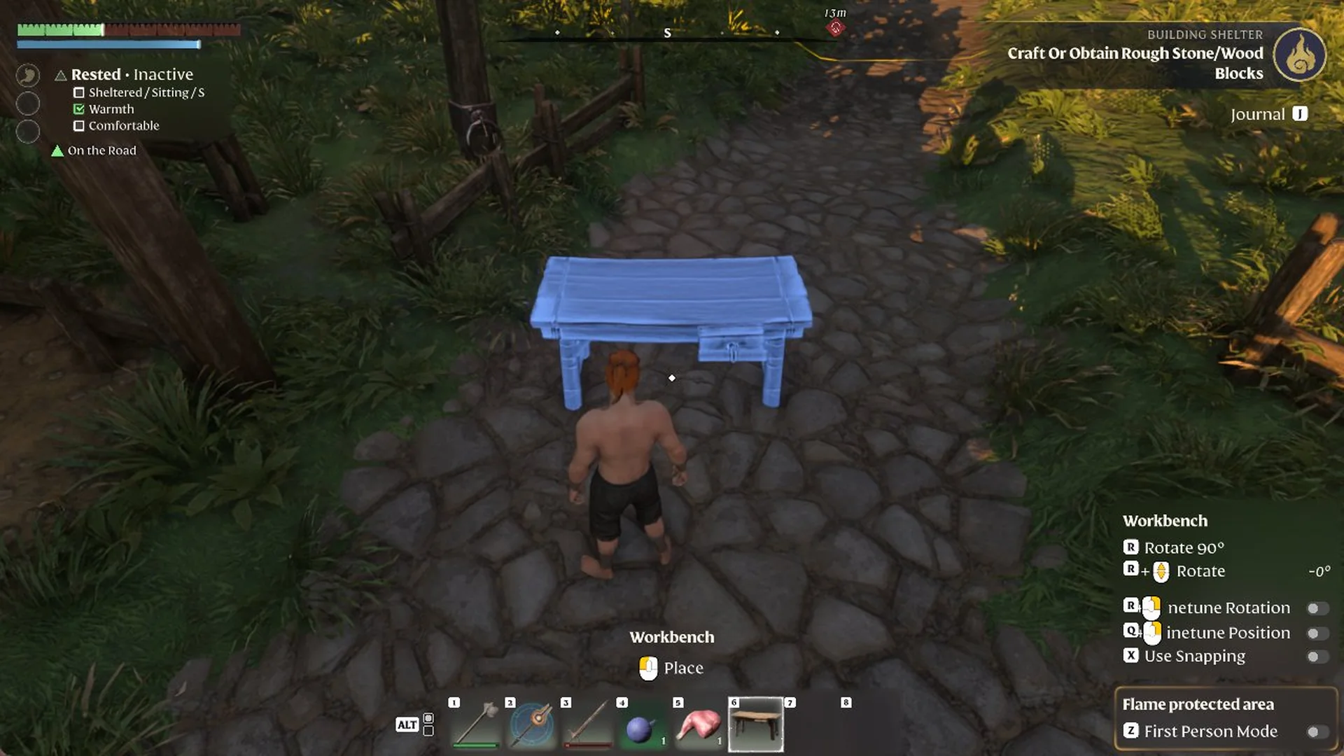Blue Workbench placement preview on a stone path with Place, Rotate and Snapping controls
