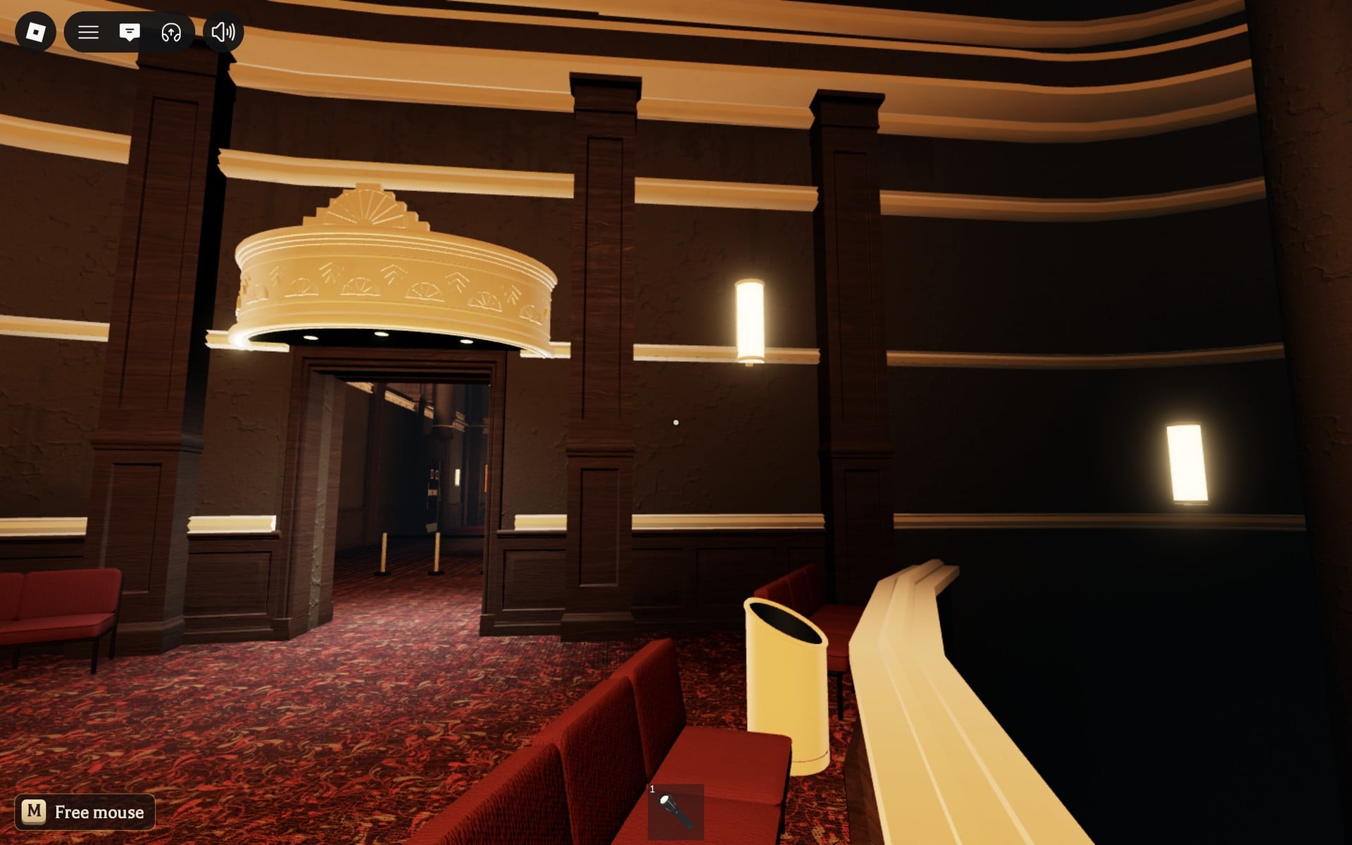 A doorway under a gold canopy leading to a dark corridor in the Floor 2 round hall