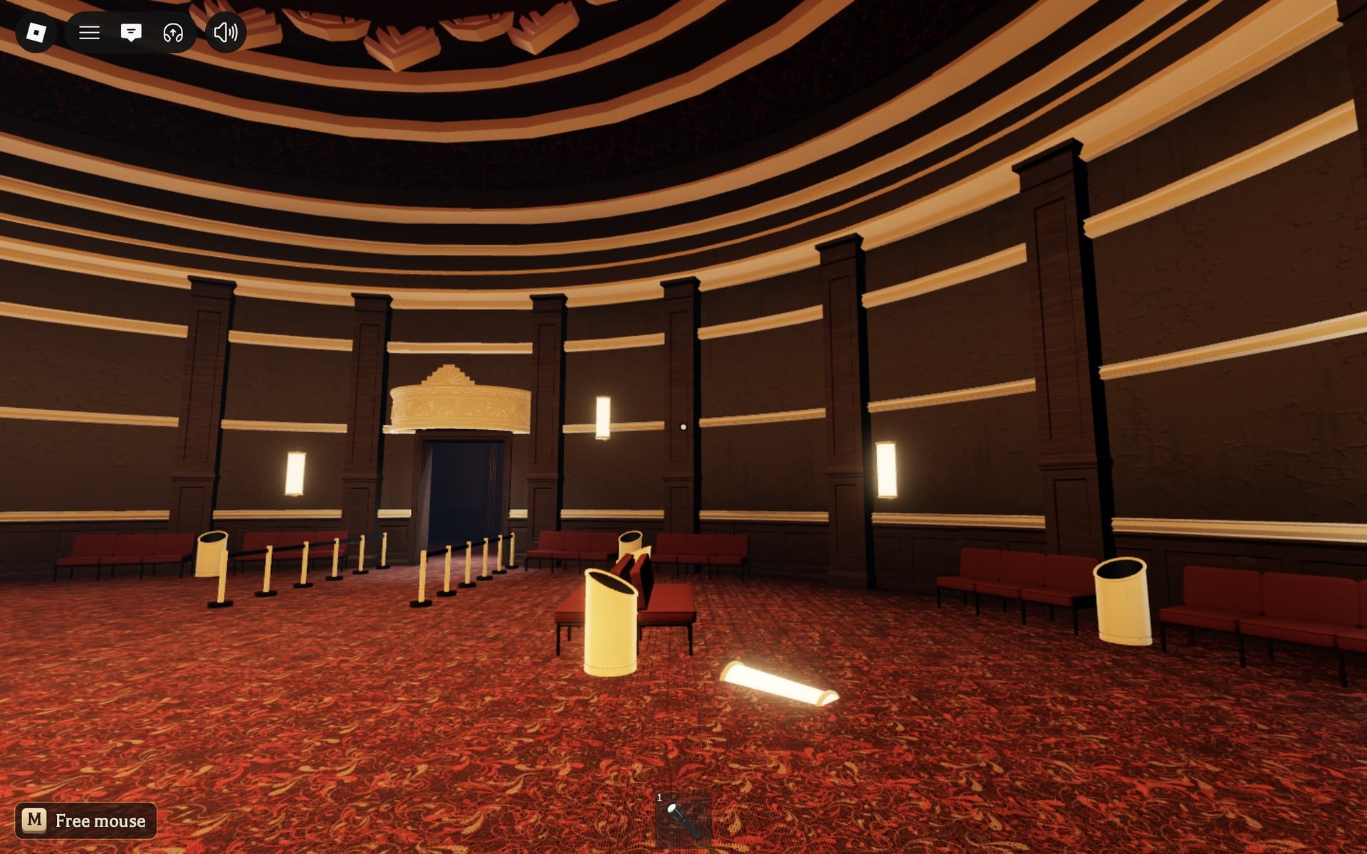 The round theatre hall outside the Floor 2 safe room, with red seats, bins and canopied doorways