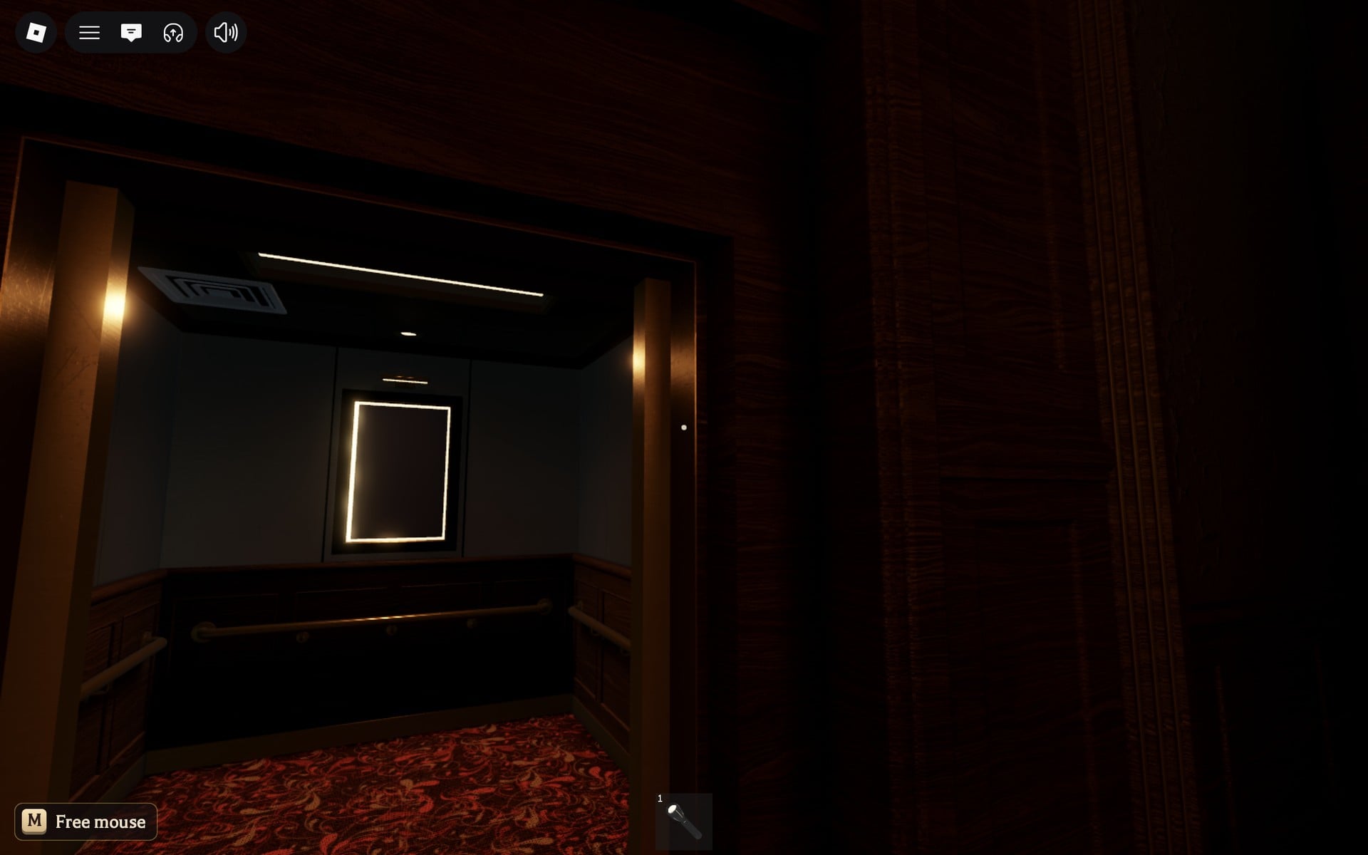 The small lit elevator car seen from the Floor 2 safe room, with a white-framed panel on its back wall