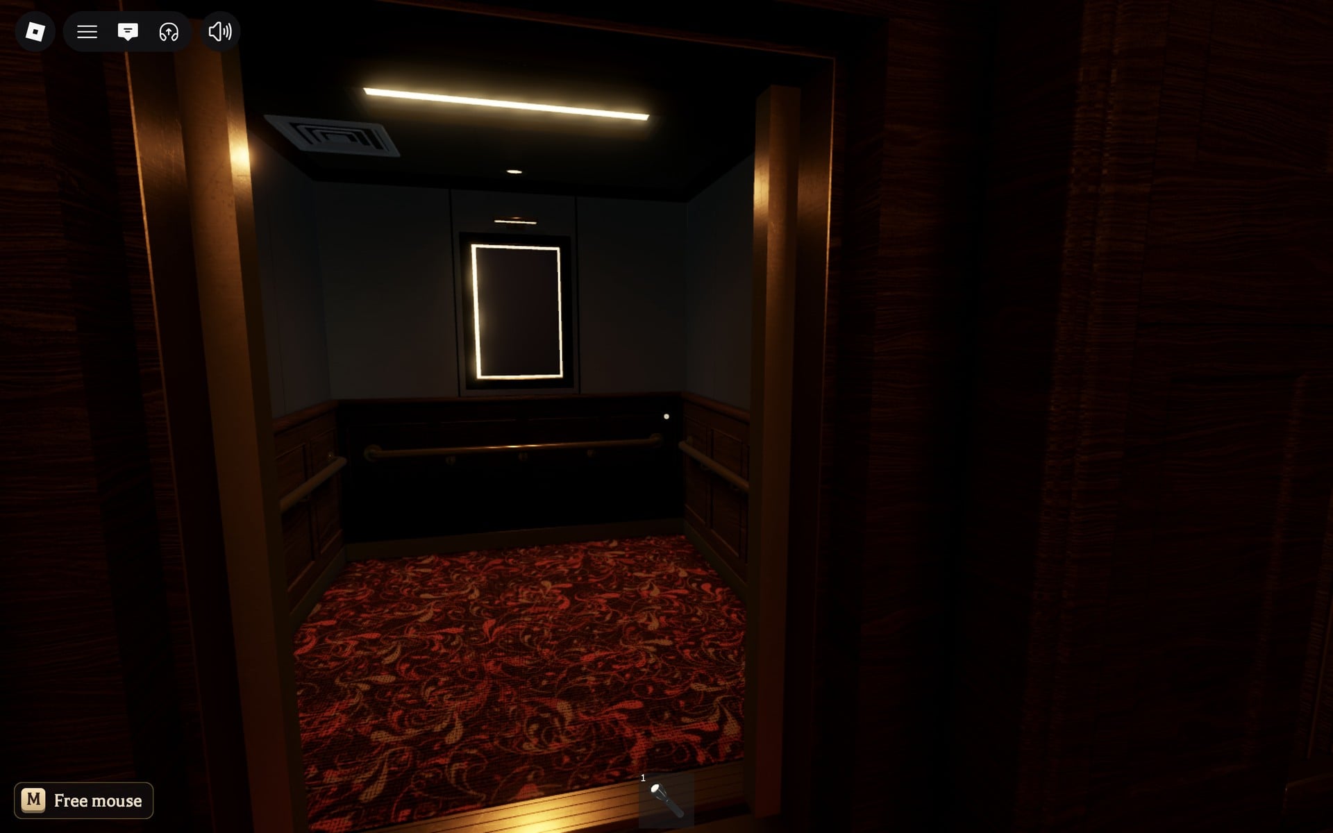 The small lit elevator car seen from the Floor 3 safe room, with a white-framed panel on its back wall