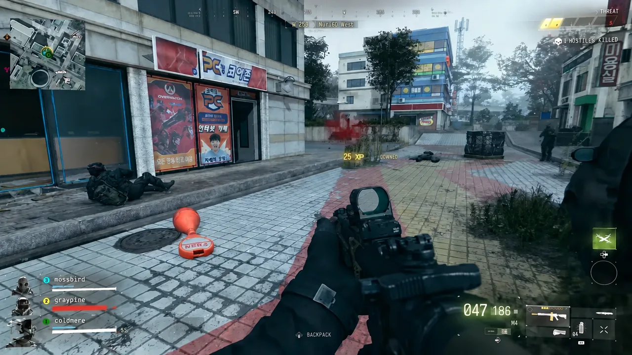 HUD notification confirming an enemy operator has been downed while the player aims down sights