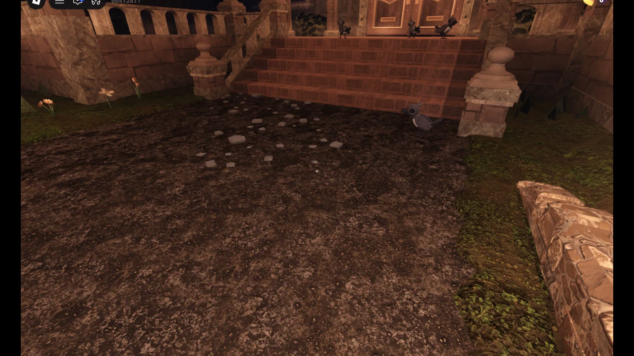 Staircase leading up to the manor's double front doors at night