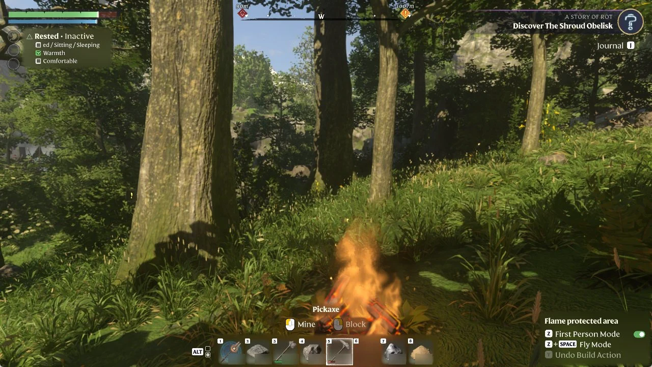 Pickaxe selected in the hotbar next to a campfire, with Mine and Block controls shown on the HUD