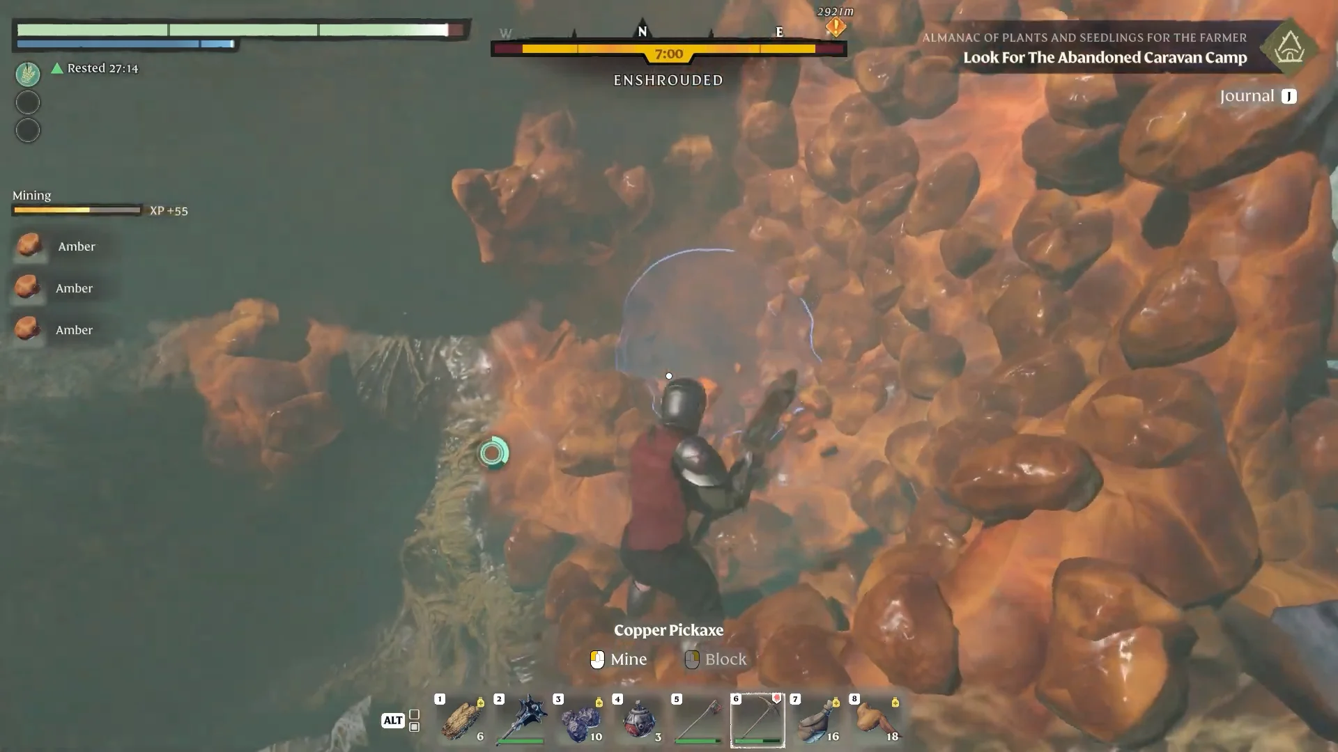 Mining an orange amber cluster with a pickaxe