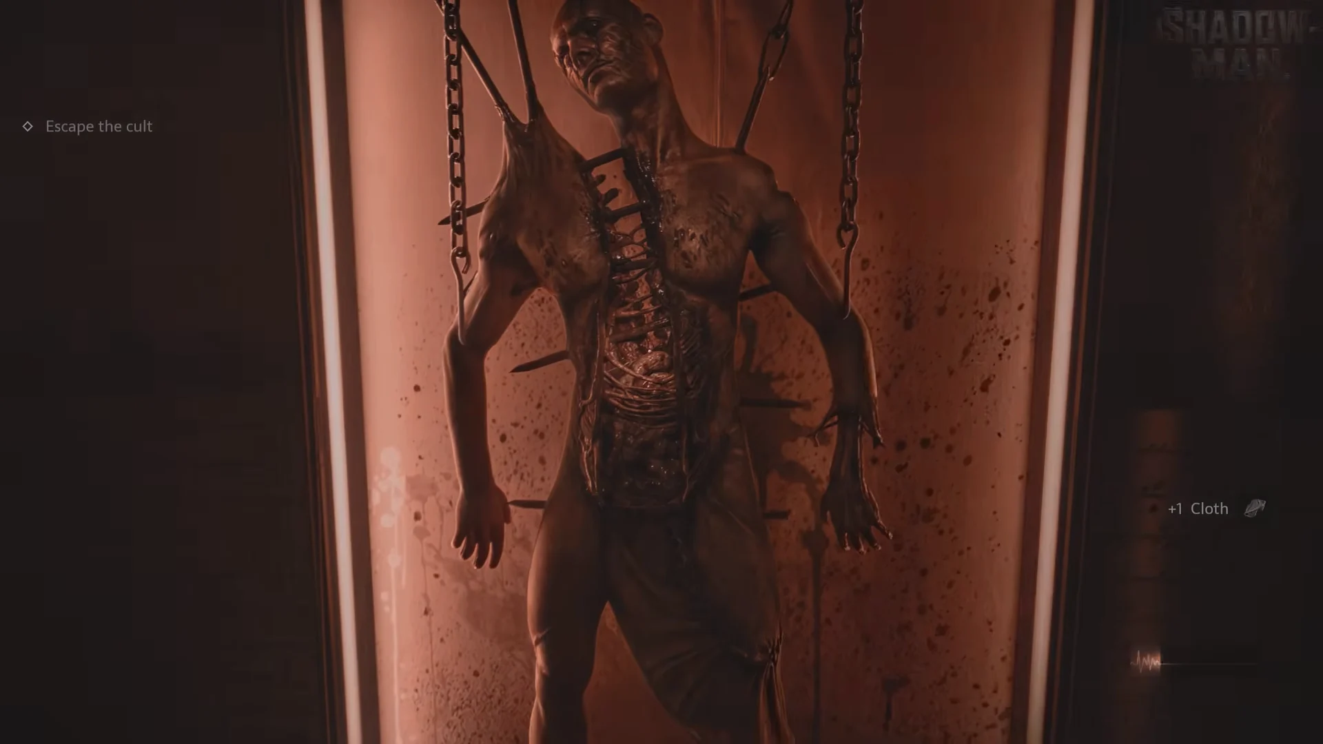 The exhibit room with the chained body
