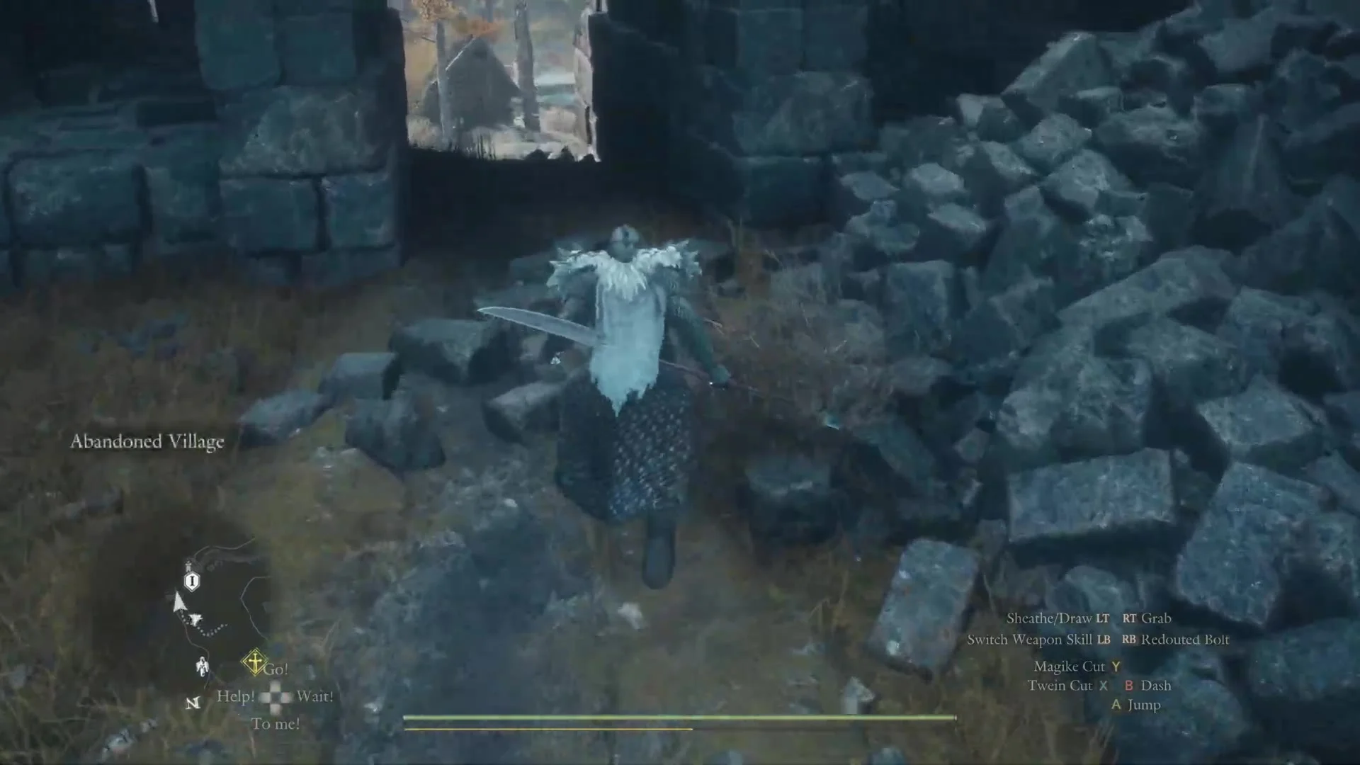 The Arisen passing the rubble beside the stone arch as the area name Abandoned Village shows on the left