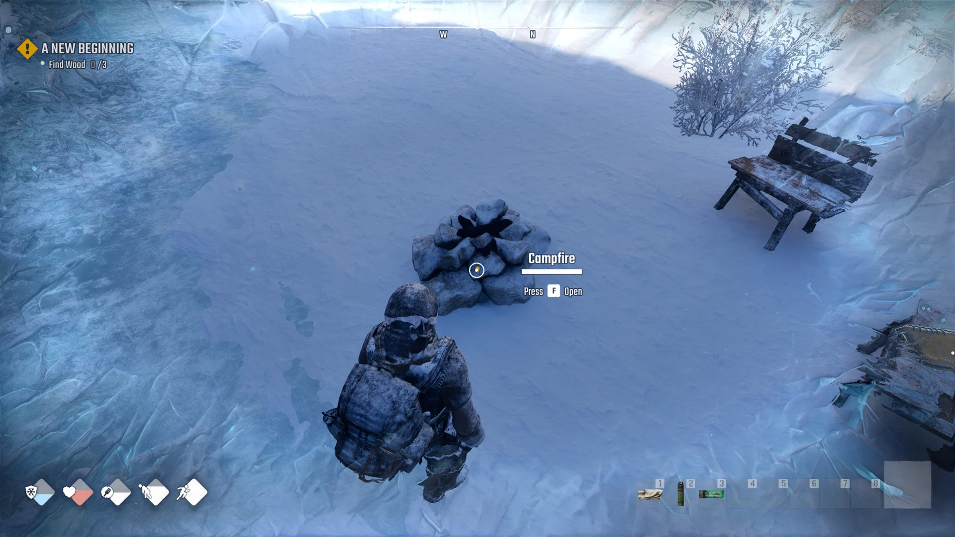 An unlit Campfire on the snow with the prompt Campfire, Press F Open