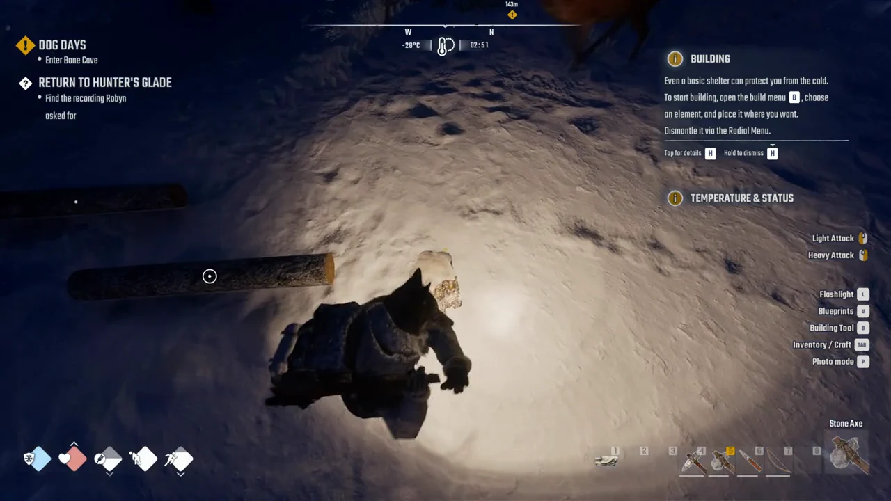 Stone Axe in hotbar slot 5 aimed at a fallen log on the snow
