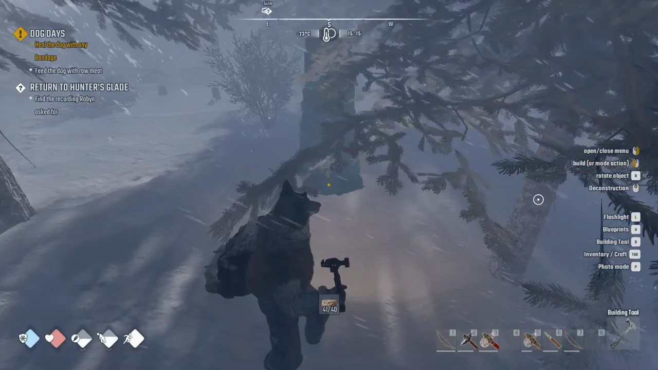 The snowy HUD with the Building Tool equipped, showing build, rotate, and deconstruction controls while aiming a placement preview.