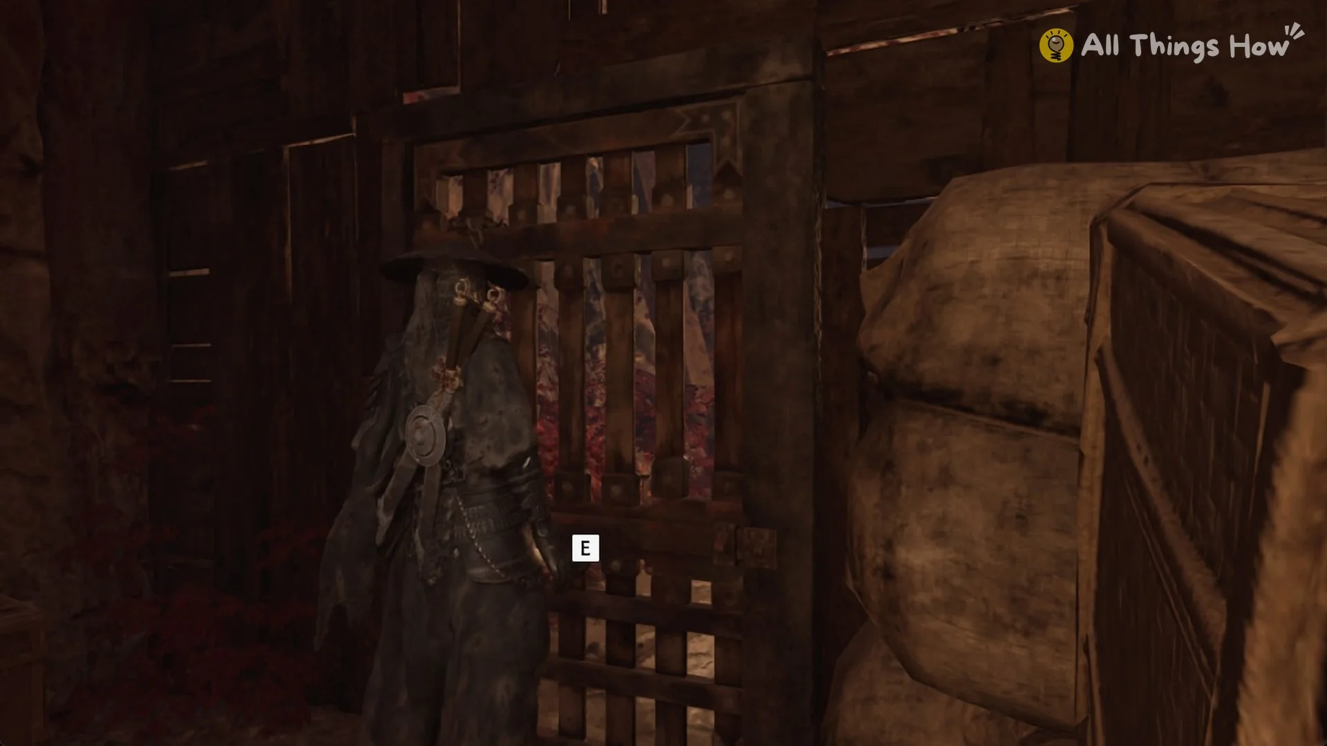 E prompt at the bandit camp gate in the Crimson Forest in Phantom Blade Zero