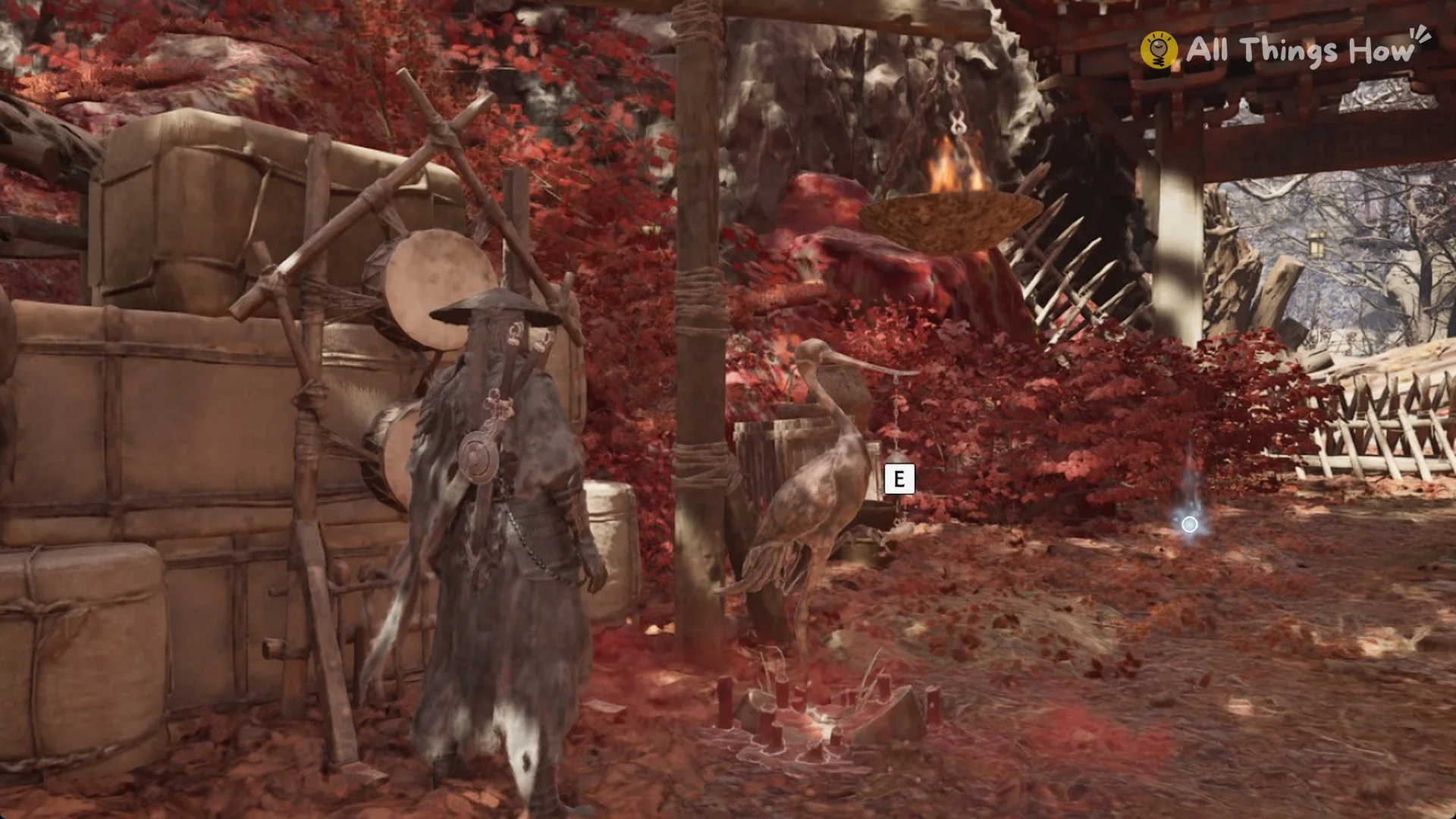 The Thieves' Camp Crane Bell with the E prompt, a small glint and the stake-barricaded gateway behind it in Phantom Blade Zero