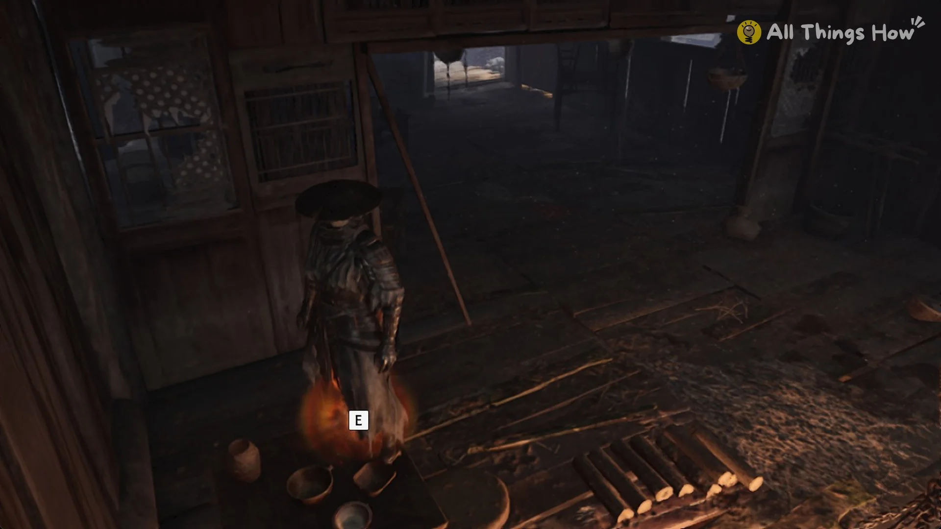 E prompt over the orange-lit spot with bowls where the Forest Outpost Courtyard Key lies in Phantom Blade Zero
