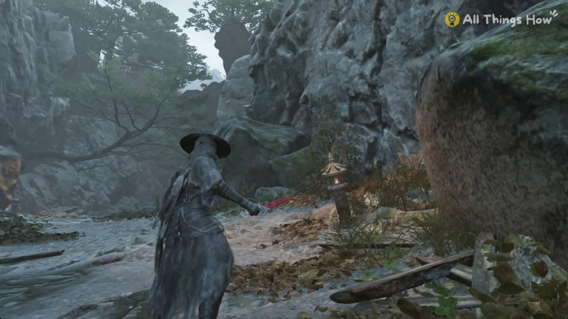 Soul at a stone lantern beside a big mossy rock above the arsonist ledge, Phantom Blade Zero