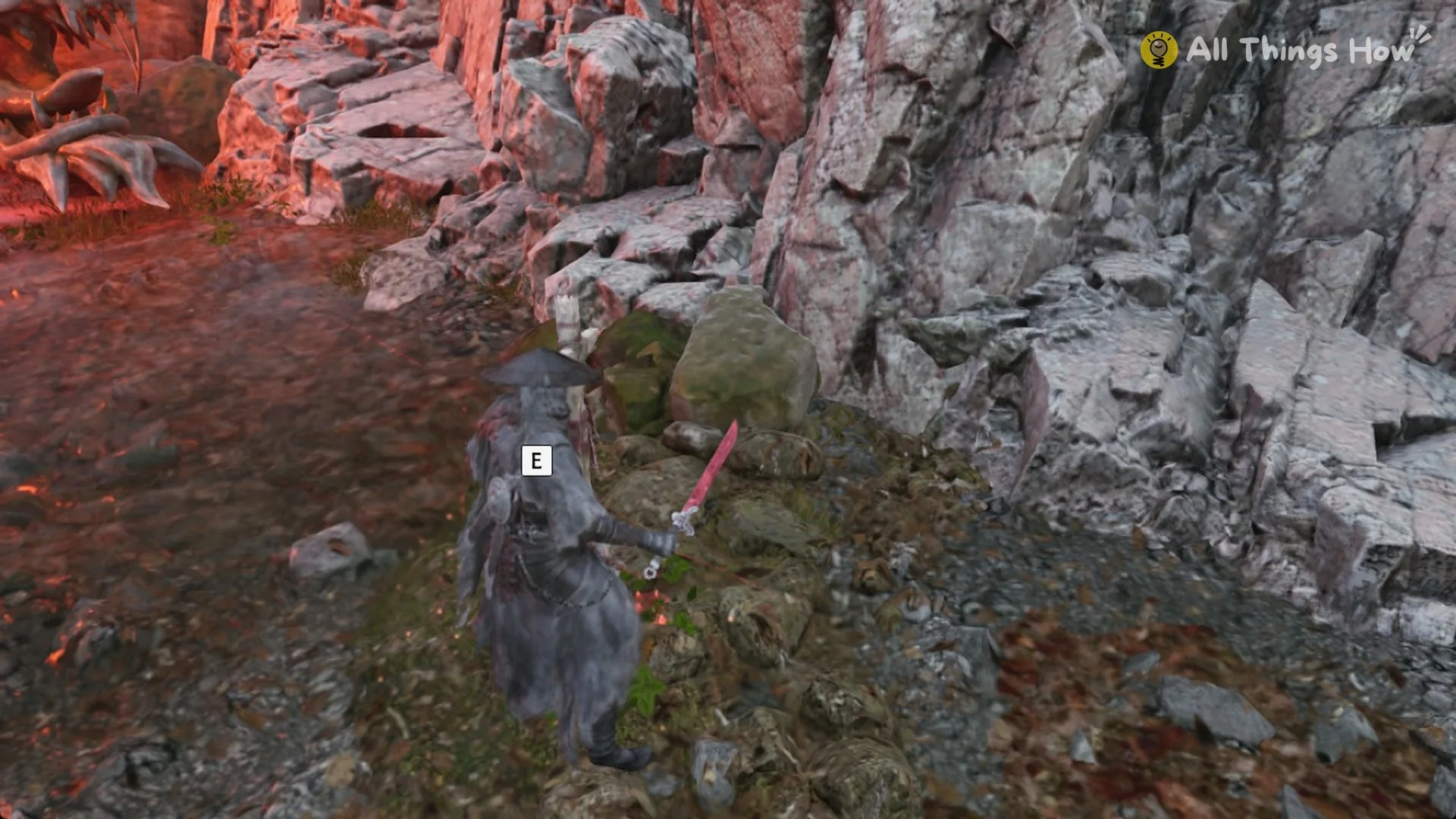 Soul at the far end of the creek basin by the red-lit cliffs with the E prompt showing, Phantom Blade Zero
