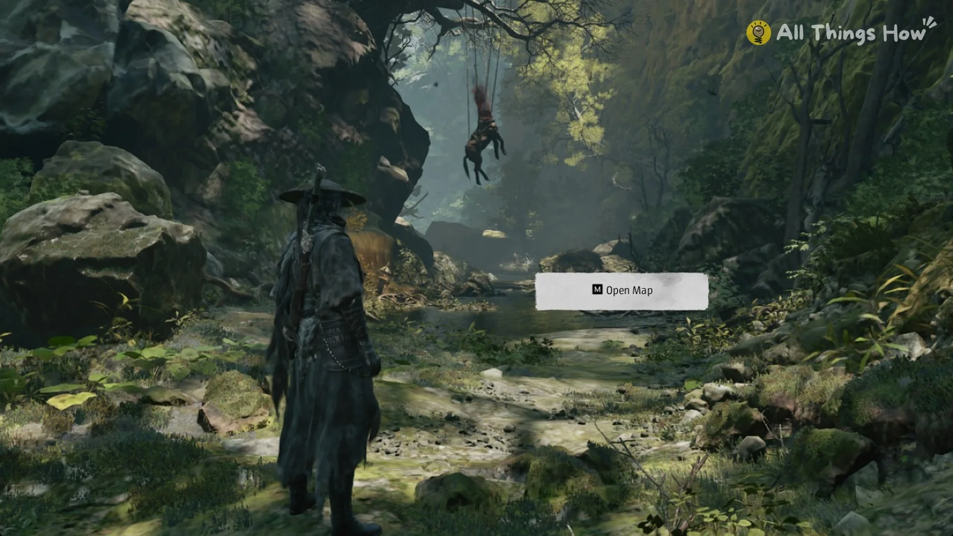 The M Open Map tutorial prompt in the Chapter 1 forest gorge in Phantom Blade Zero