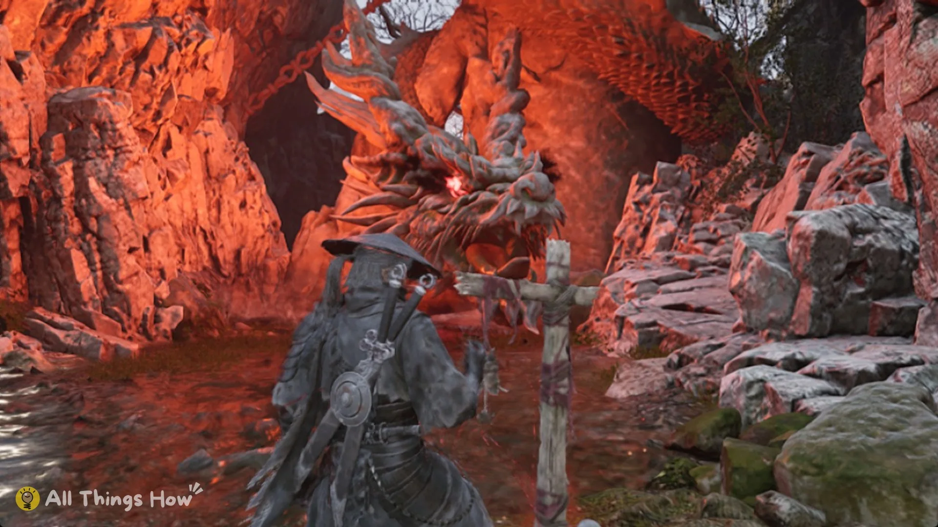 Soul at the Mirrorwood Long Pillar bell, a wooden cross in front of a giant dragon statue at a red-lit cave mouth, Phantom Blade Zero
