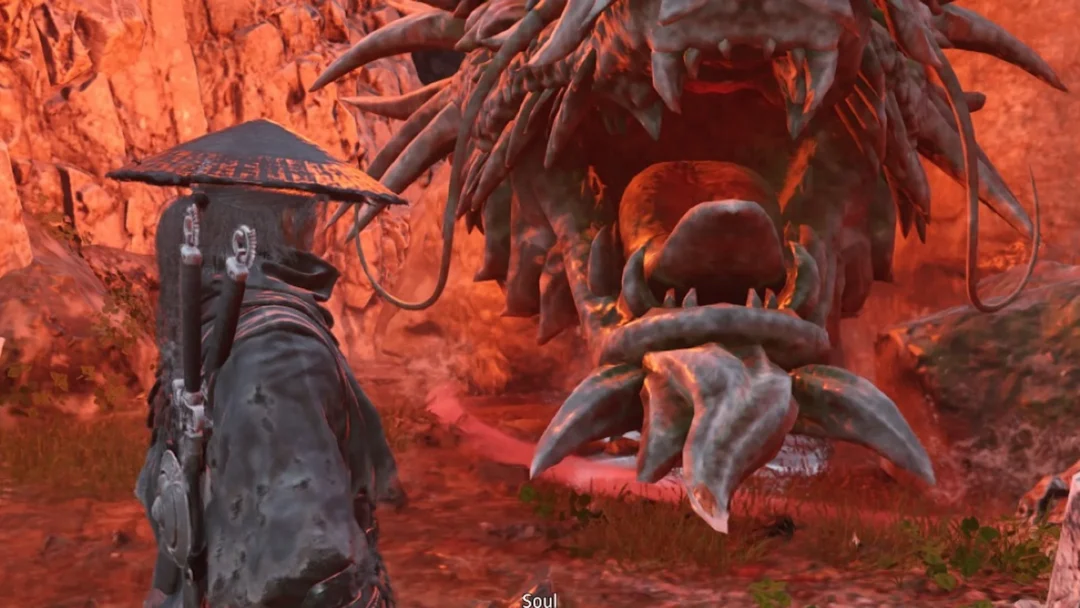 Soul standing before the Mirrorwood Lóng Pillar dragon statue in a red-lit cave in the Crimson Forest, Phantom Blade Zero