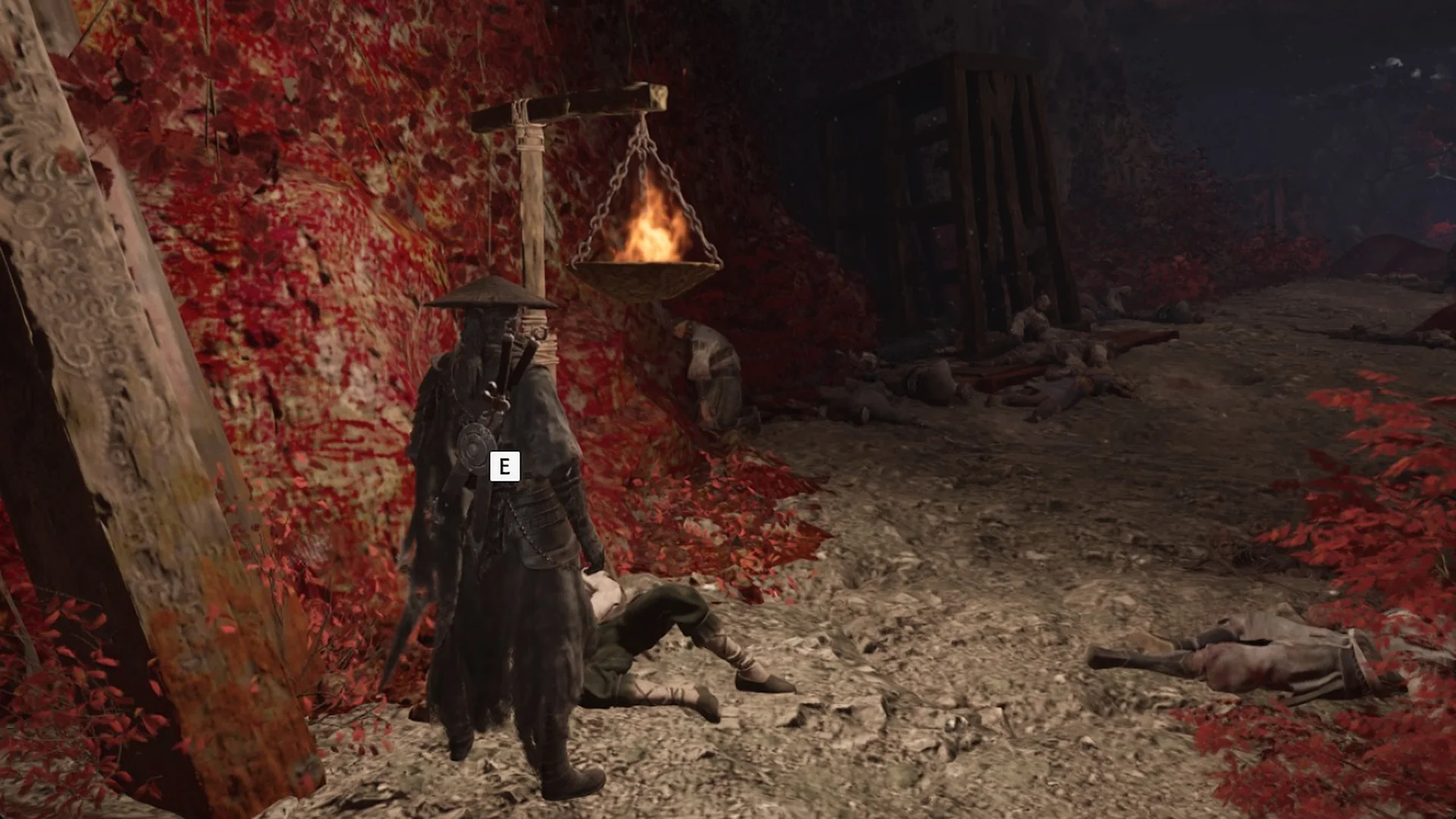The interact prompt on the wounded thief near the Outlaw Trap bell in Phantom Blade Zero