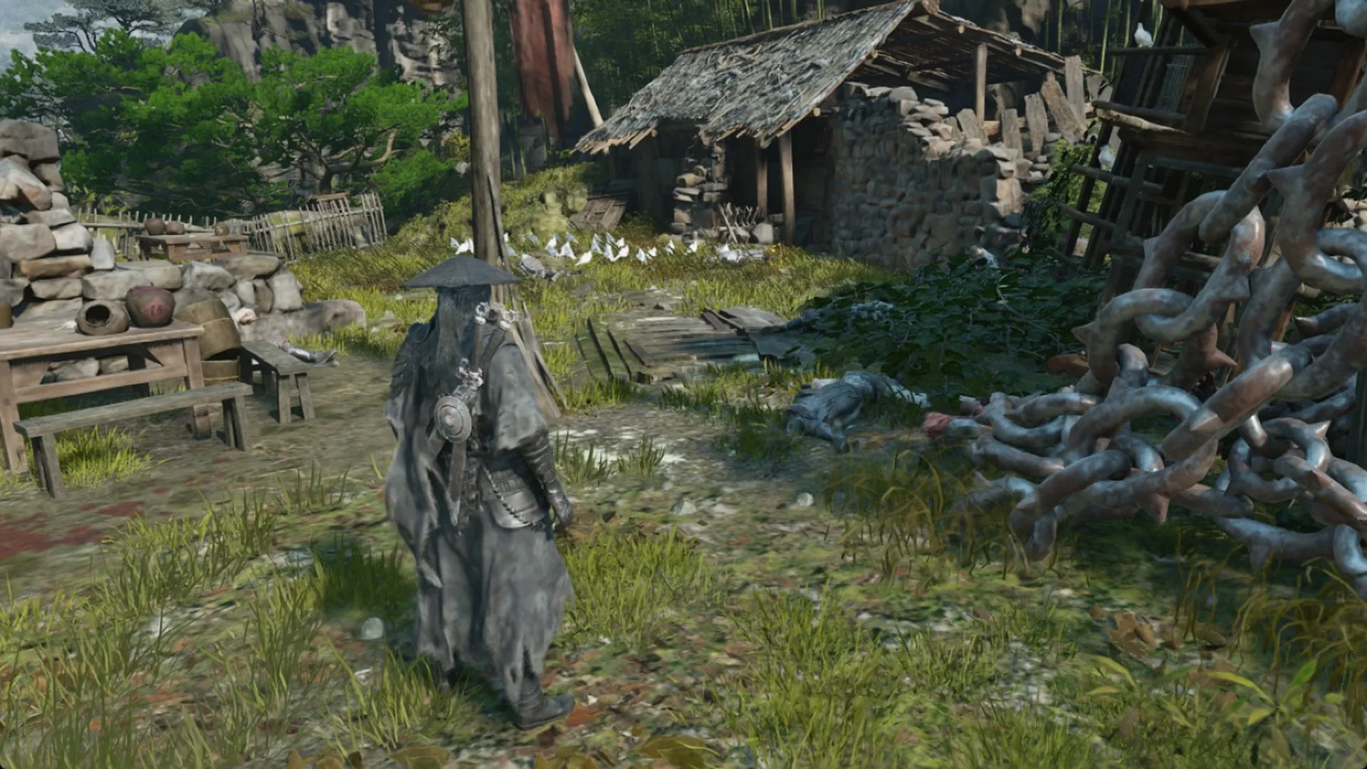 Soul in a grassy yard by a stone hut in Phantom Blade Zero