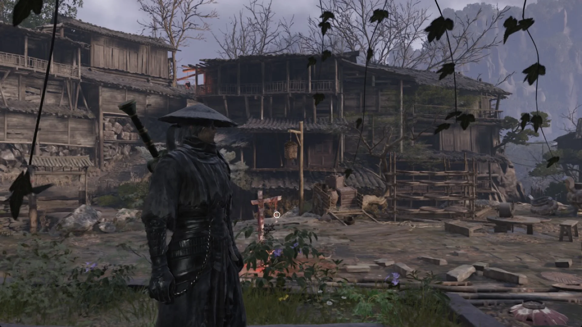 Soul in a Pangzhen yard by a bell and stilt houses in Phantom Blade Zero